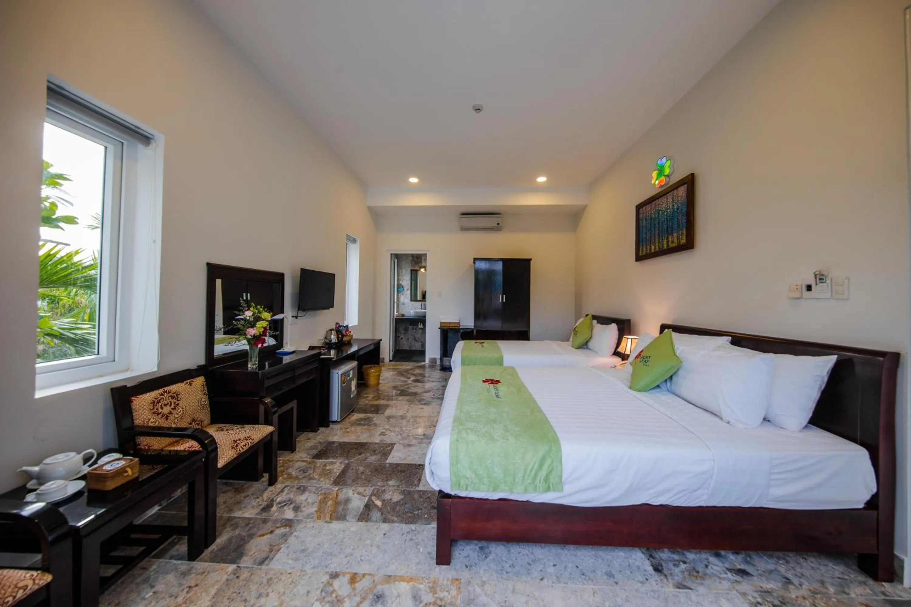 Bed in Lucky Leaf Hoian Villa