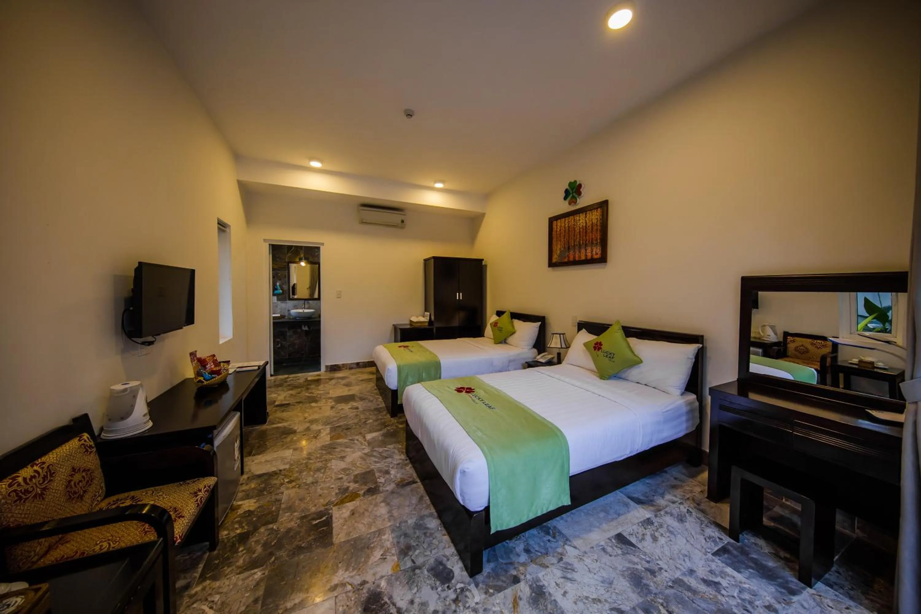 Bed in Lucky Leaf Hoian Villa