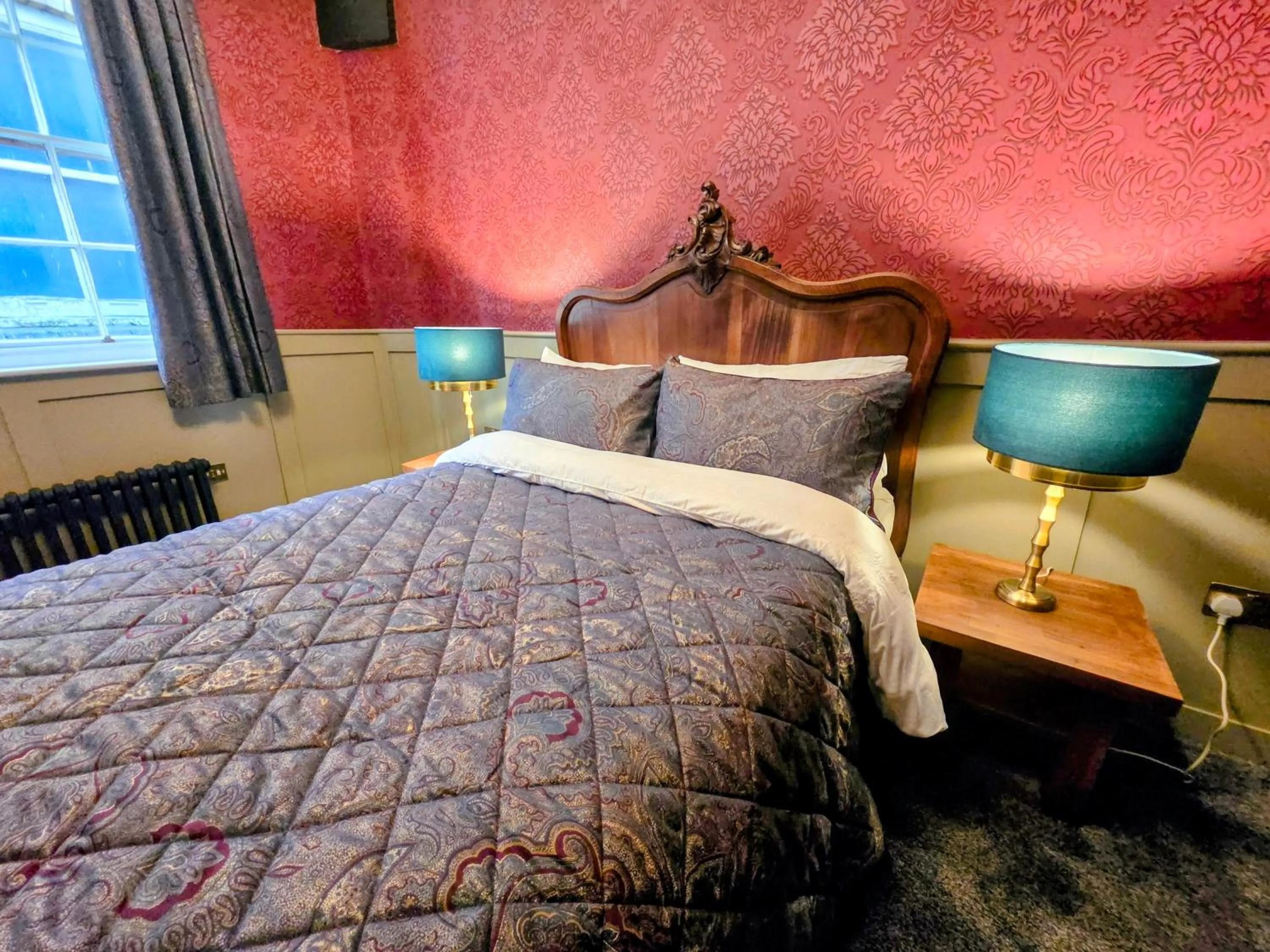 Bed in The New Inn by Roomsbooked