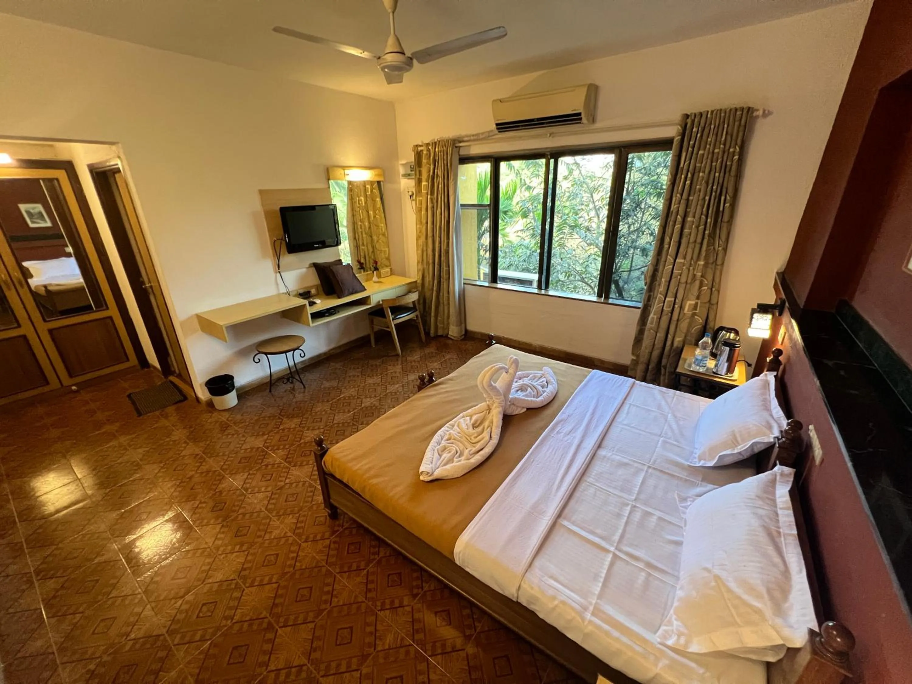 Bed in Konkan Crown Resort & Club