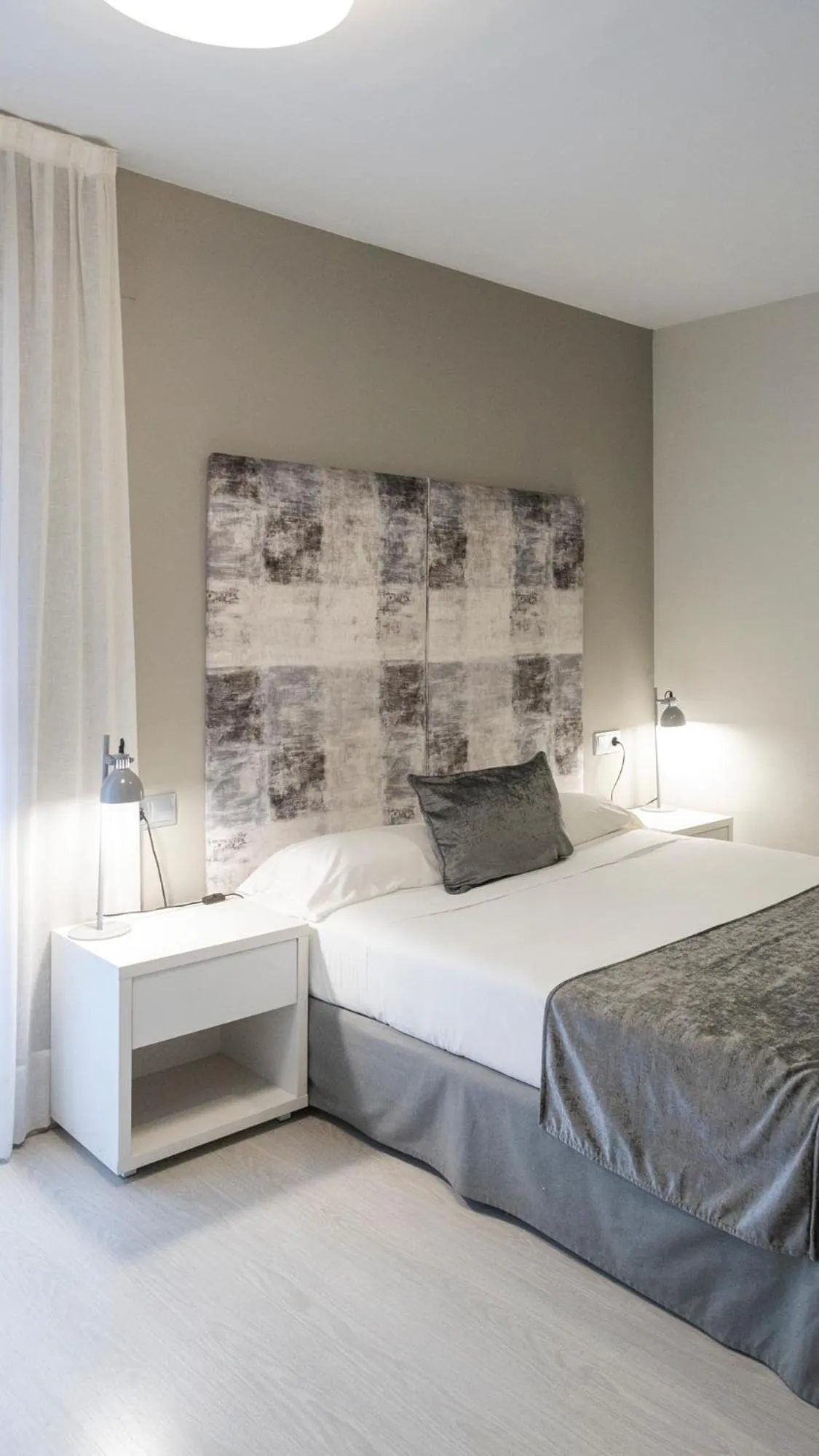 Bed in Apartamentos Real Lleida