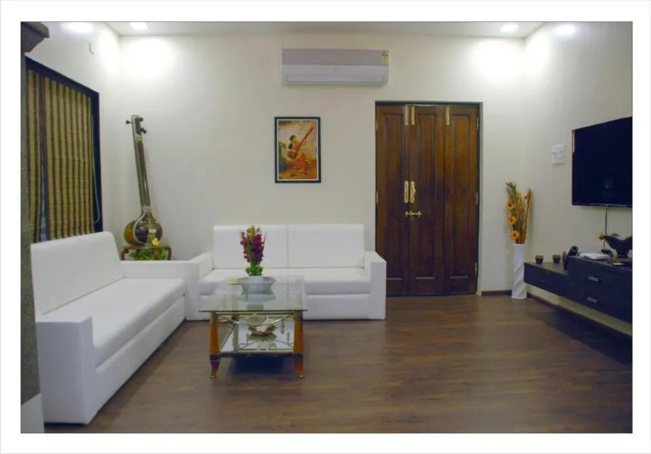Communal lounge/ TV room, Bed in Matoshri Homestay Airport Road