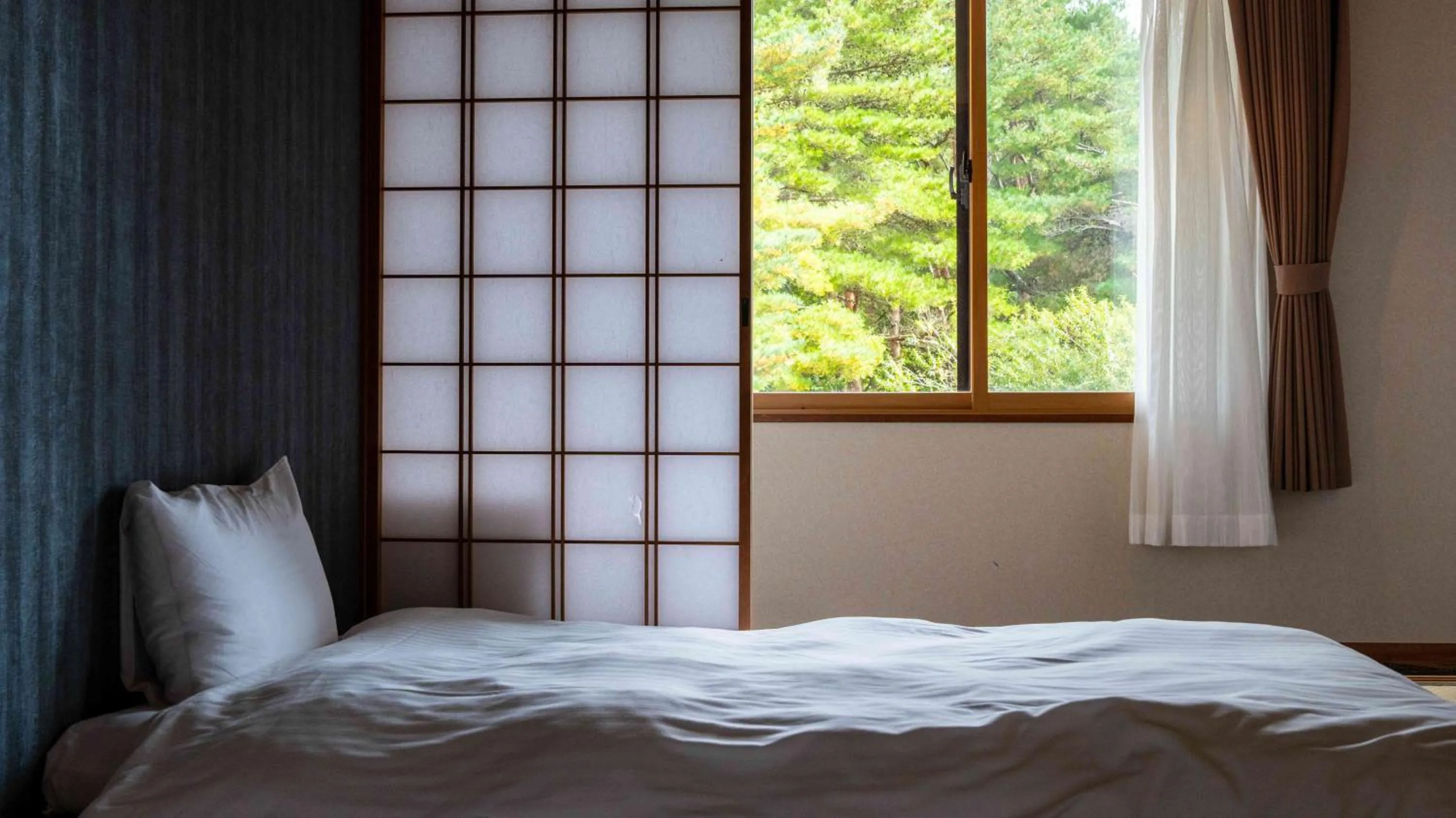 Bed in Motosu Phoenix Hotel