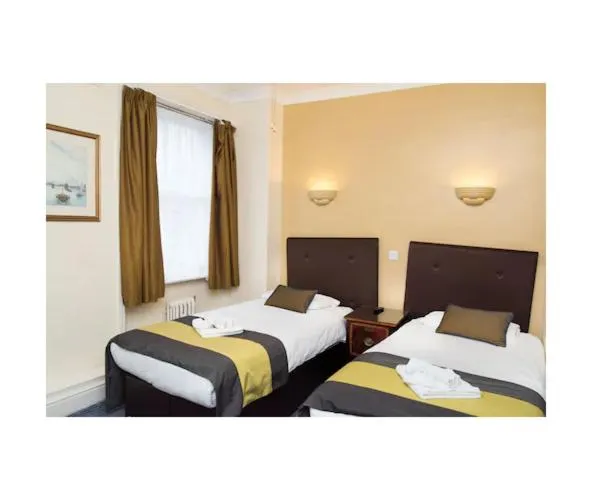Bed in Rose Court Hotel