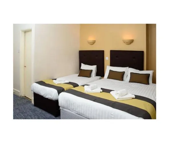 Bed in Rose Court Hotel