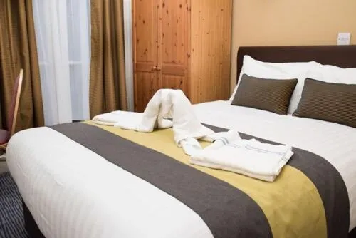 Bed in Rose Court Hotel