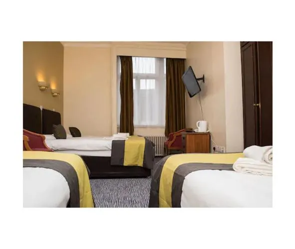 Bed in Rose Court Hotel