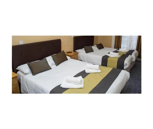 Bed in Rose Court Hotel