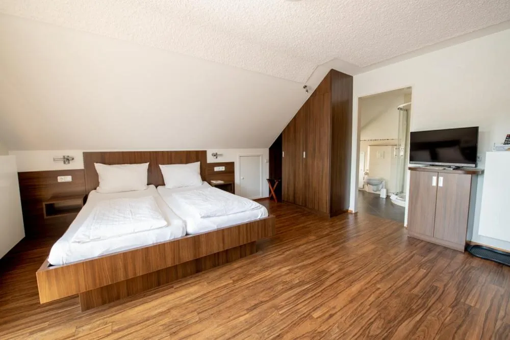 Bed in Garni Hotel Henn