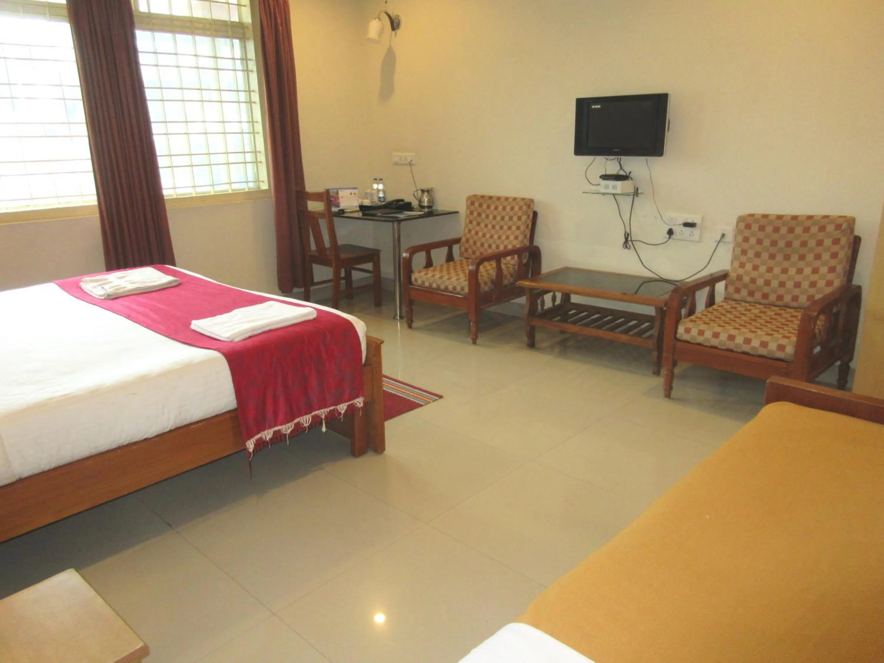 Bed in KSTDC Hotel Mayura Velapuri Belur