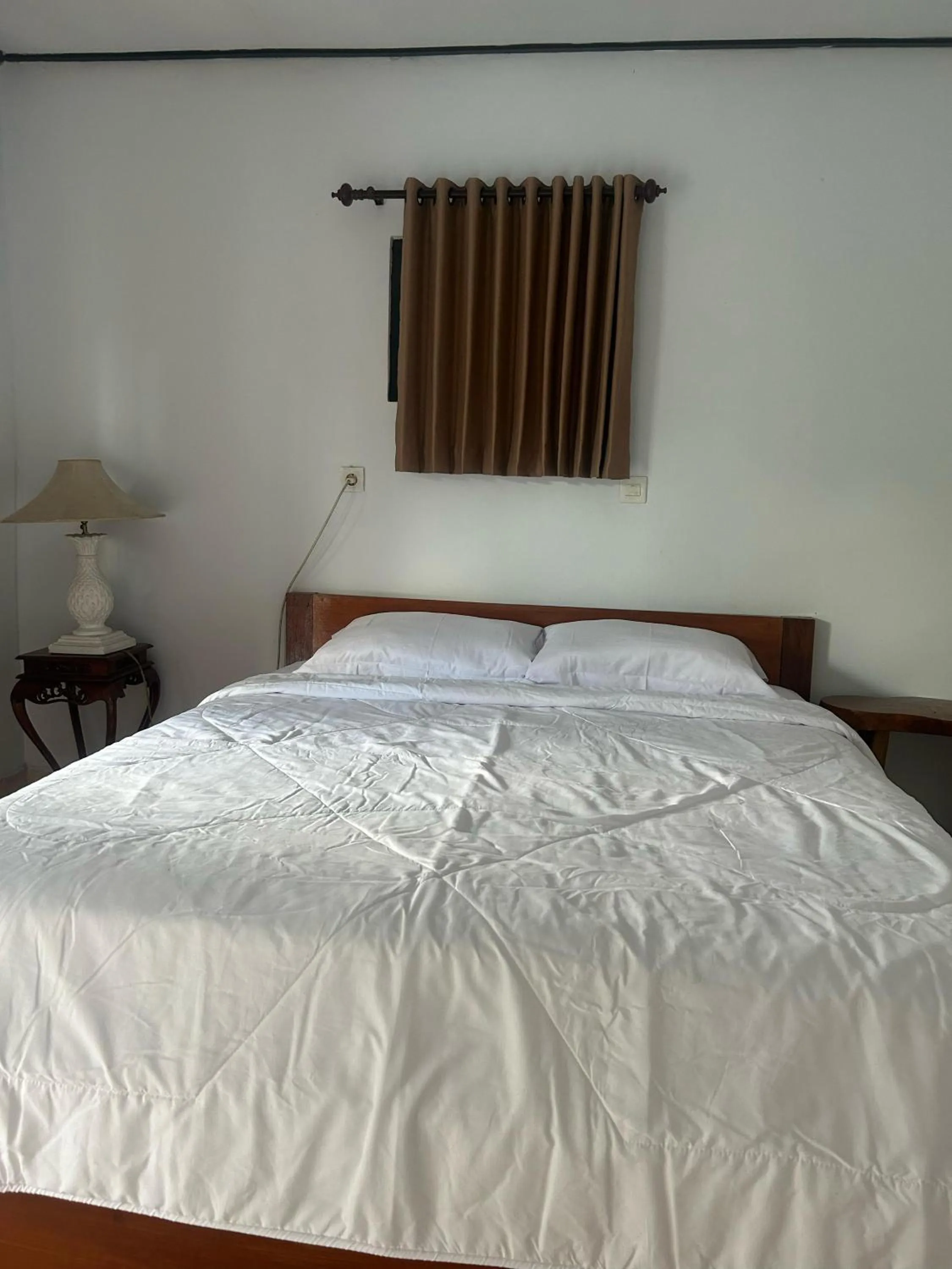 Bed in Darma Putra Hotel