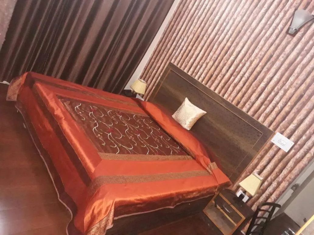 Bed in Trimurti Pine Valley Resort