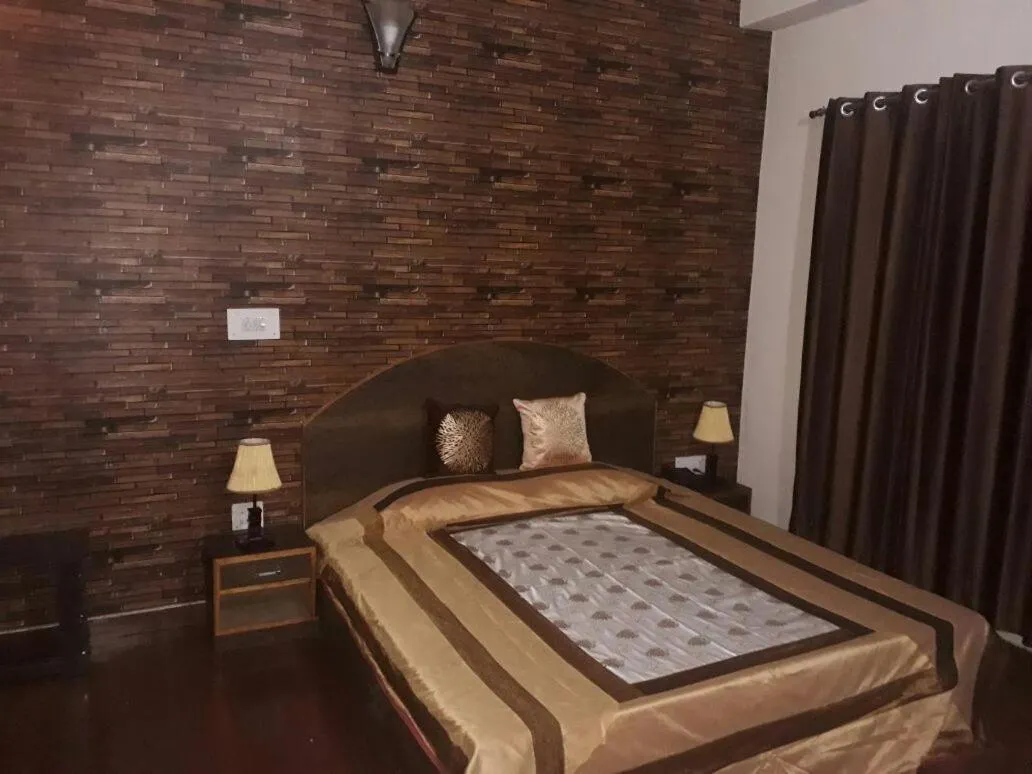 Bed in Trimurti Pine Valley Resort
