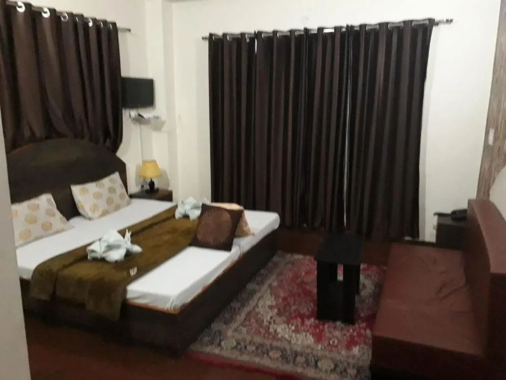 Bed in Trimurti Pine Valley Resort