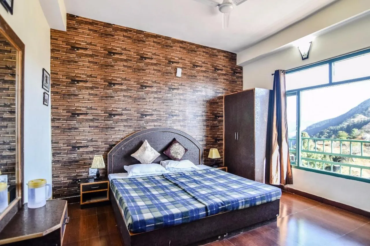 Bed in Trimurti Pine Valley Resort