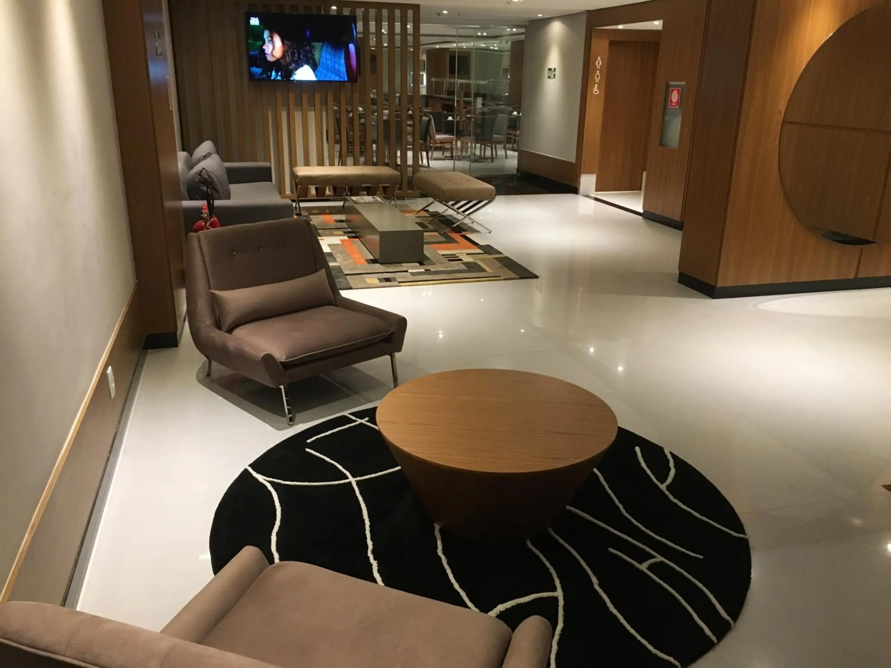 Communal lounge/ TV room in Petit Rio Hotel