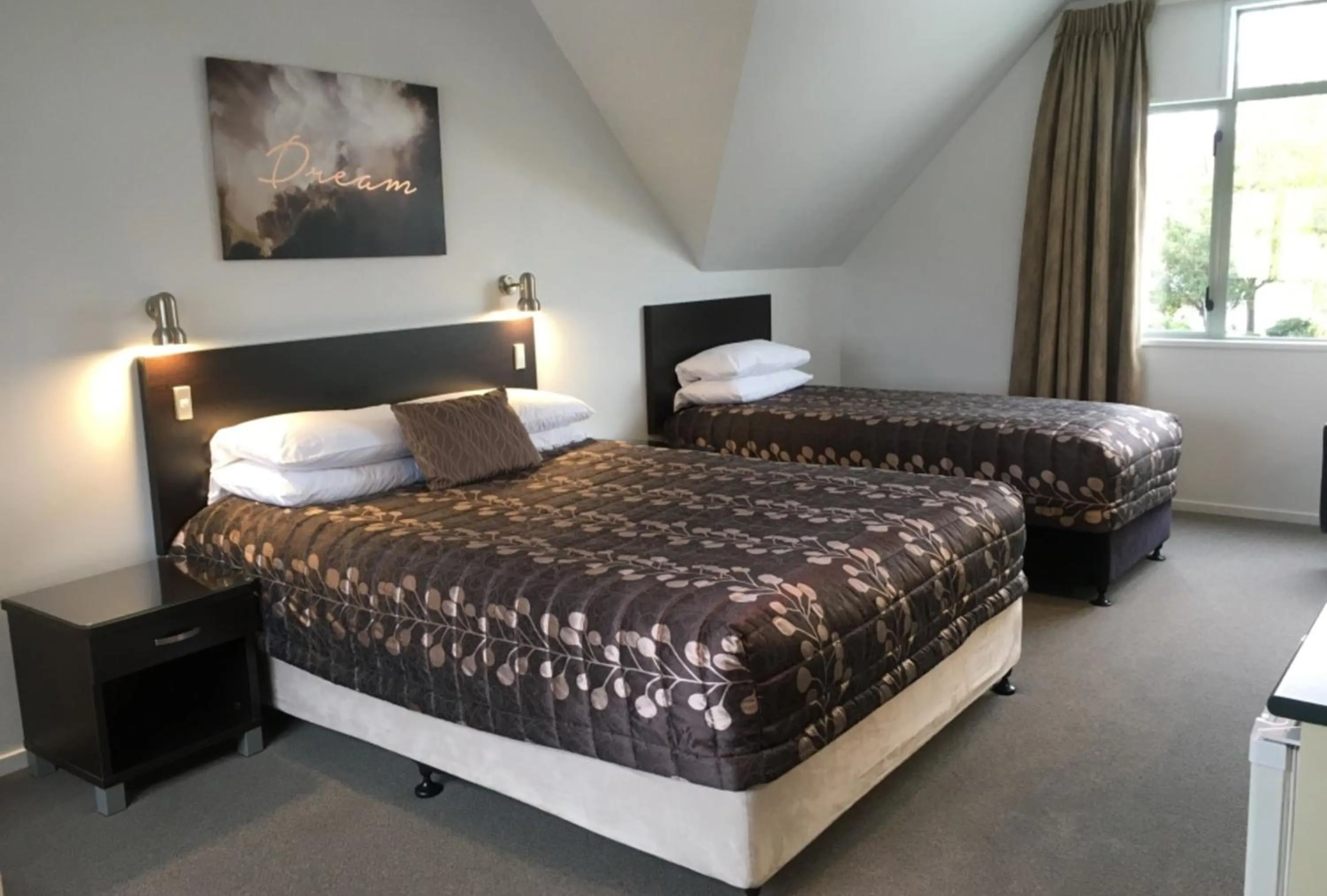 Bed in Colonial Manor Motel