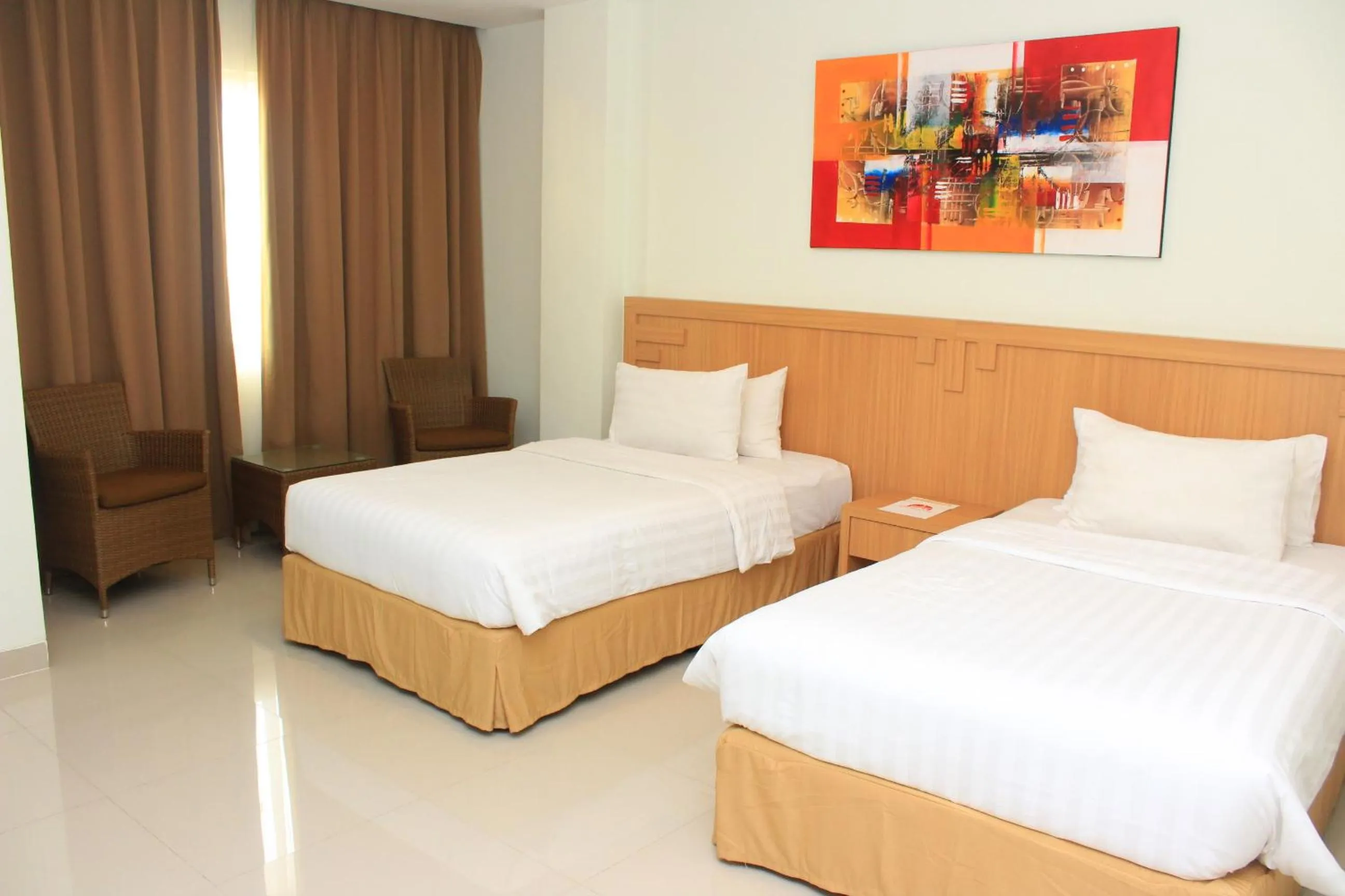 Bed in Naka Hotel Kupang