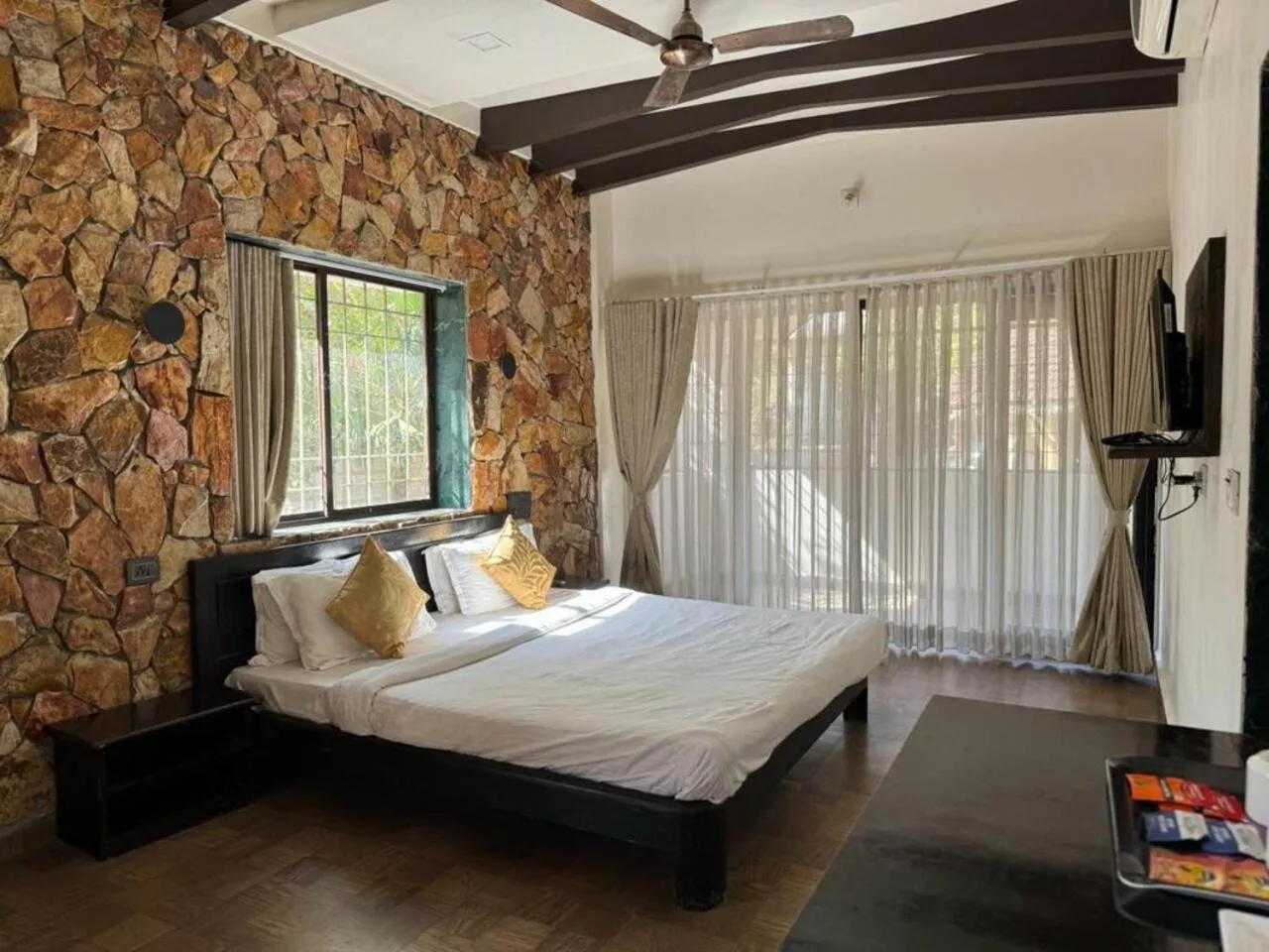 Bed in Gir Lions Paw Resort with Swimming Pool