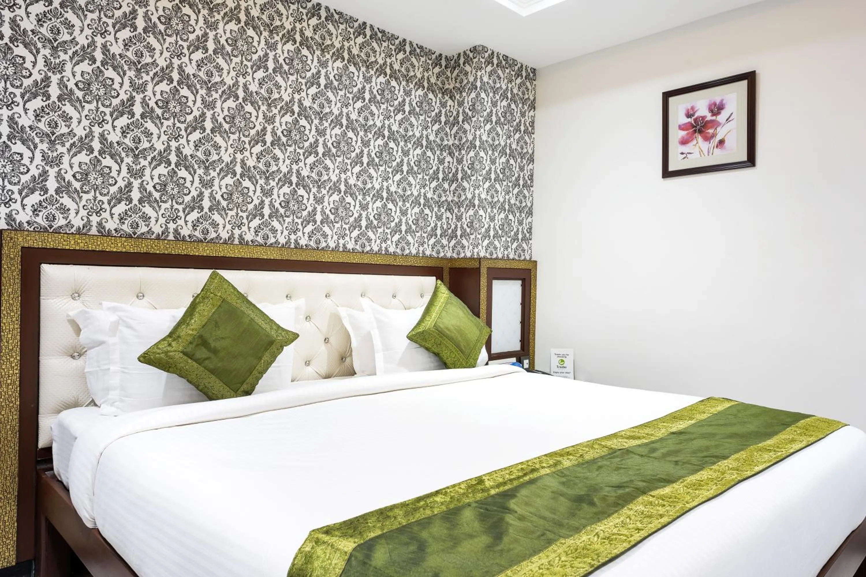 Bedroom, Bed in Treebo Empire