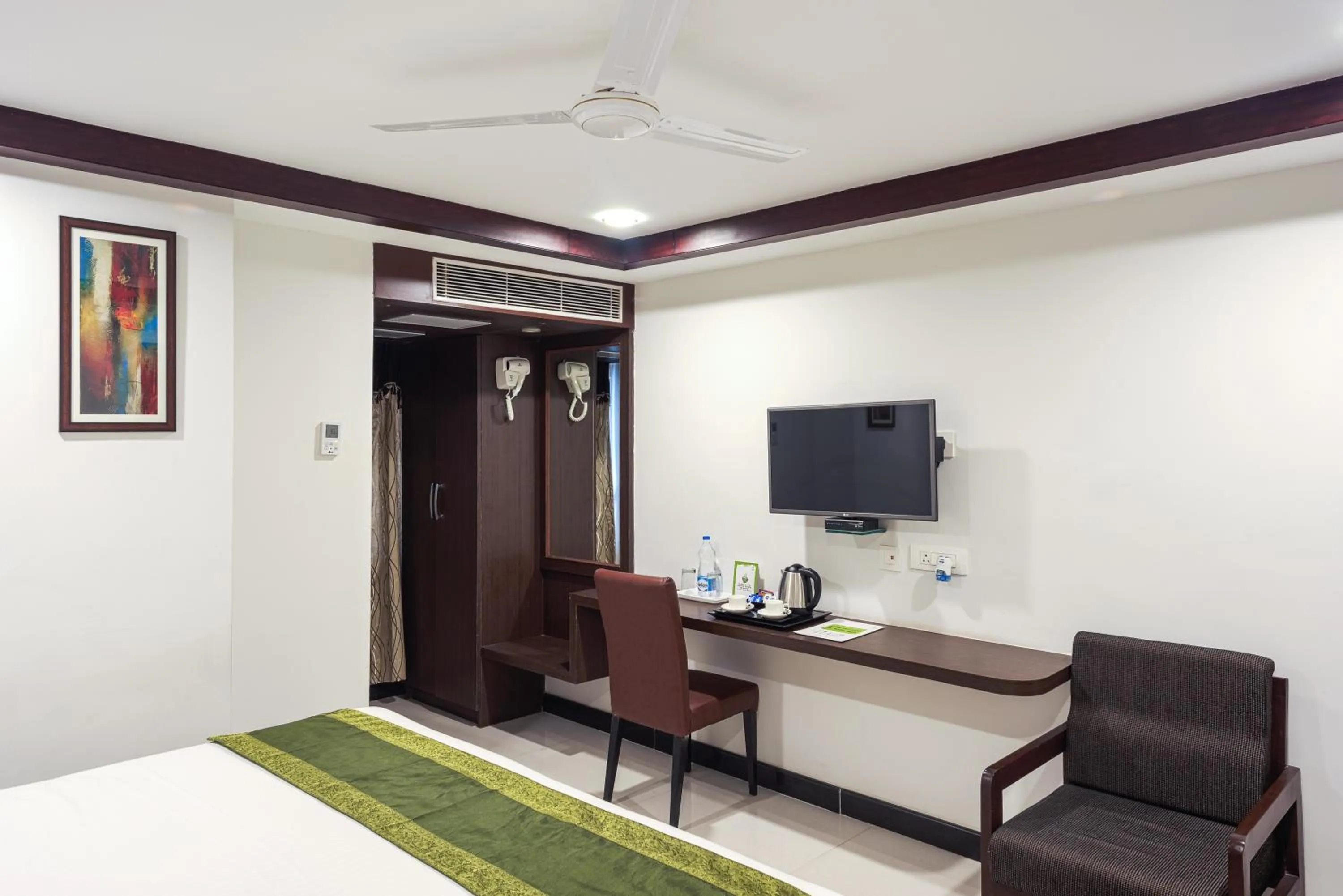 Bedroom, Bed in Treebo Empire