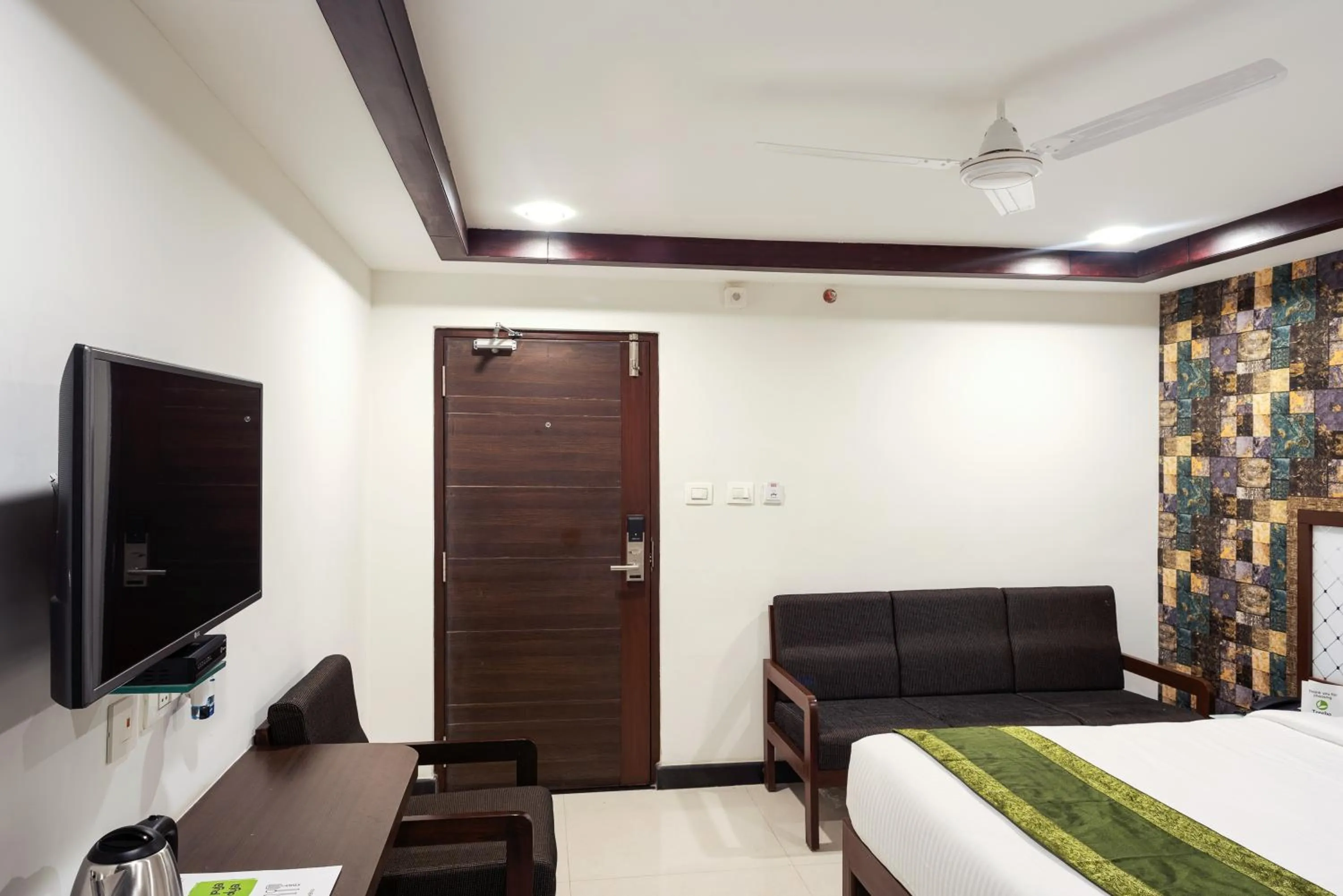 Bedroom, Bed in Treebo Empire