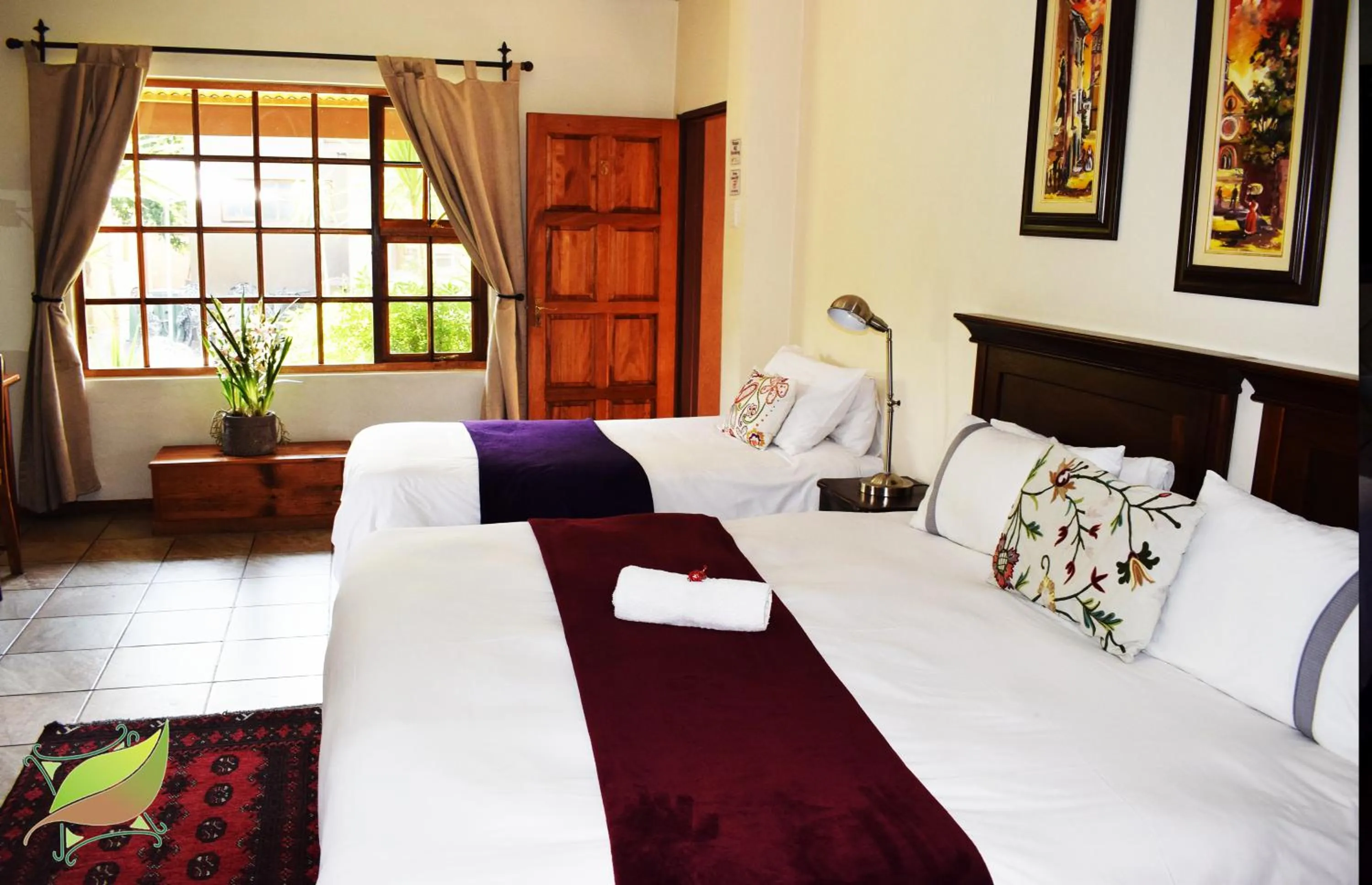 Bed in Greenleaf Guest Lodge