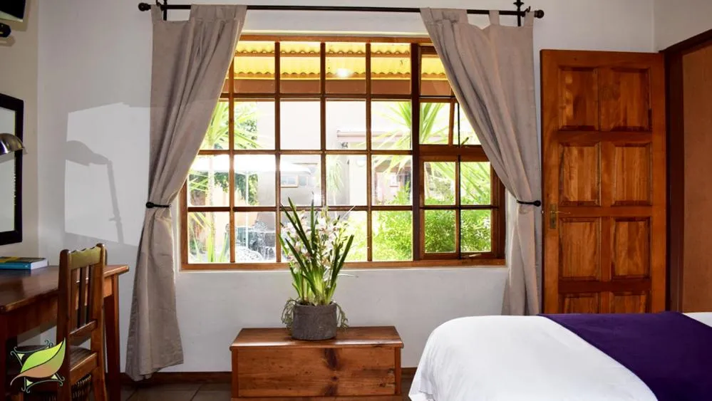 Garden view, Bed in Greenleaf Guest Lodge