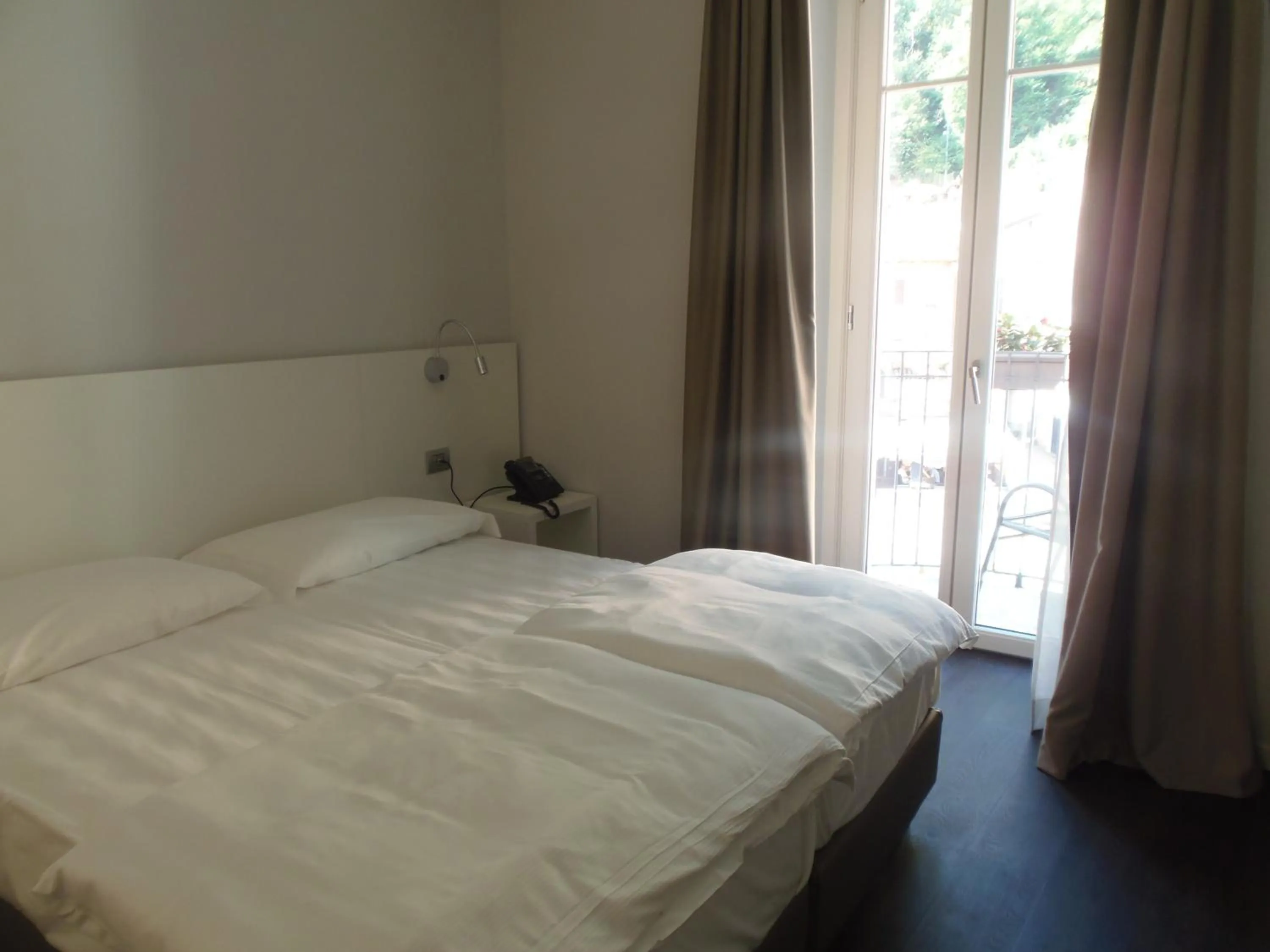 Bed in Albergo Dongo