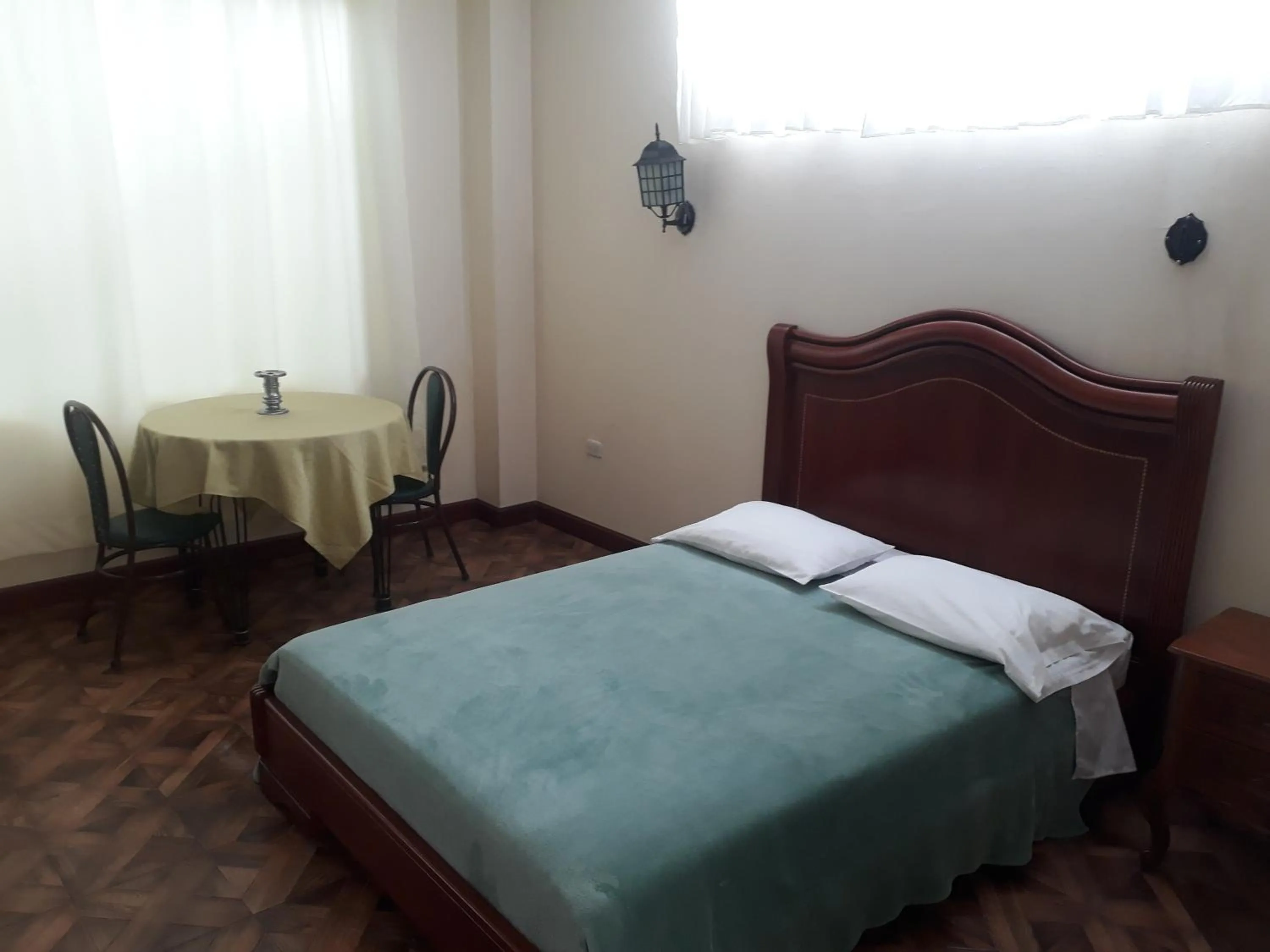 Bed in El Cardenal Hotel