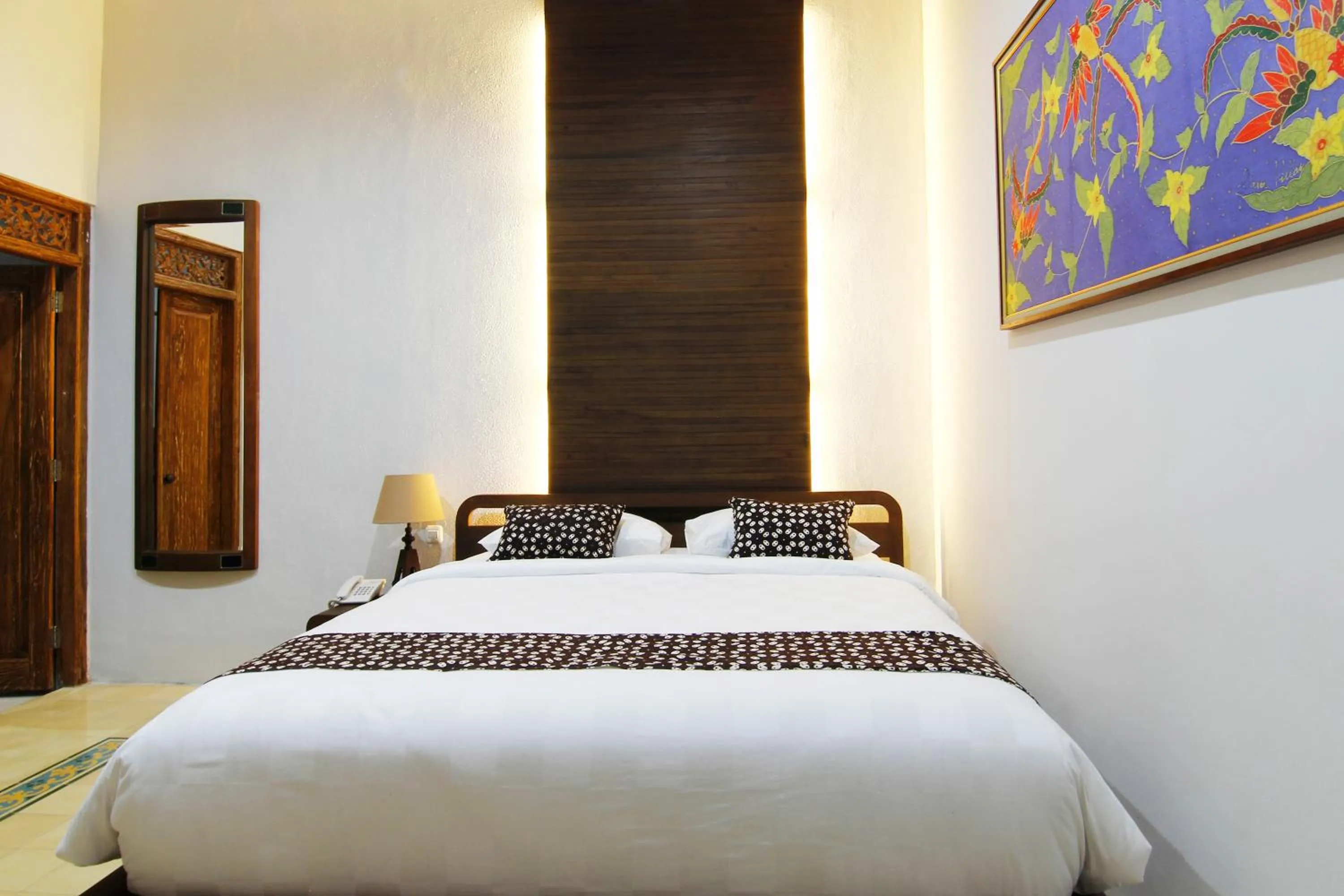 Bed in Joglo Mandapa Boutique Hotel