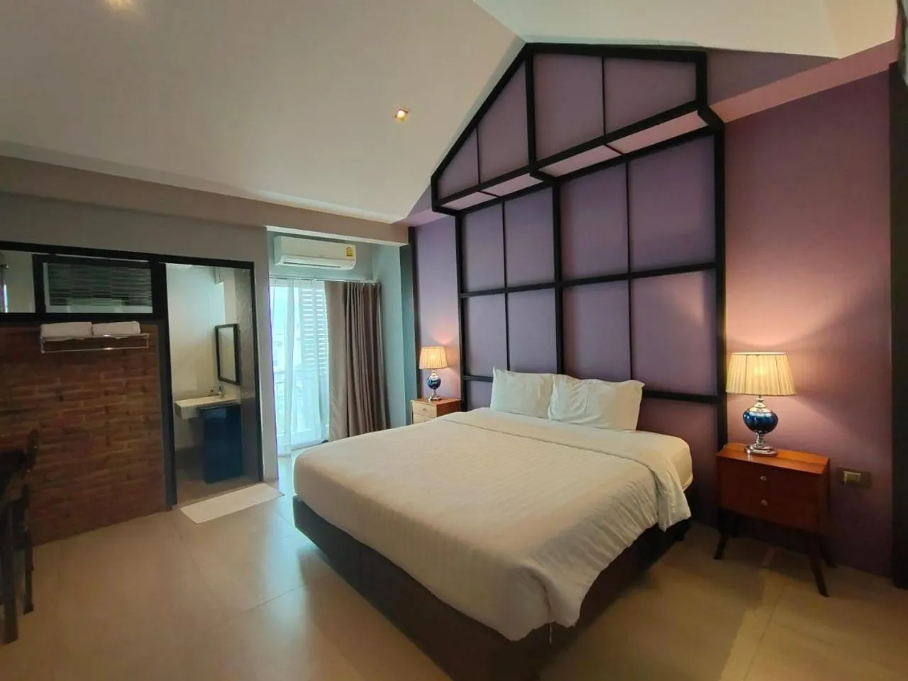 Bed in Qoo Hotel