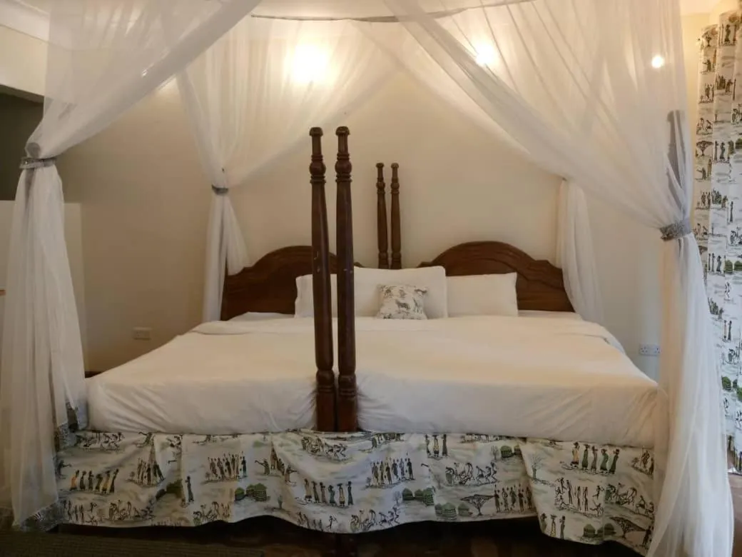 Bed in Lake Bunyonyi Rock Resort