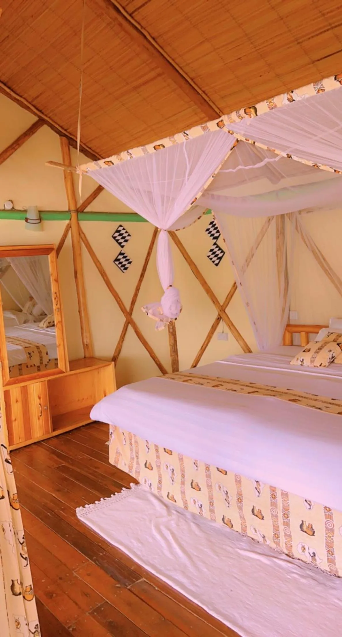 Bed in Lake Bunyonyi Rock Resort