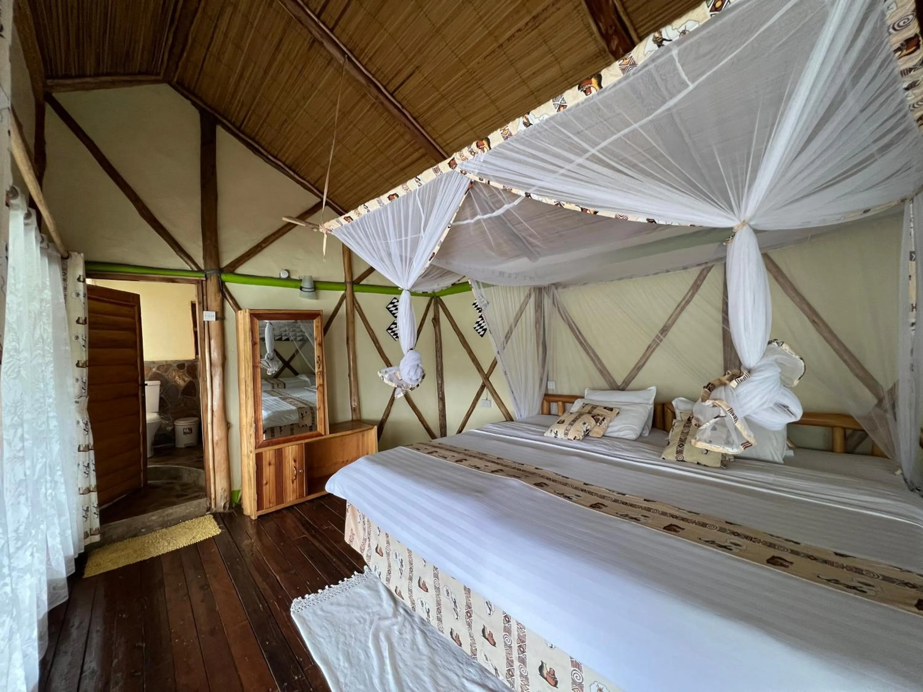 Bed in Lake Bunyonyi Rock Resort