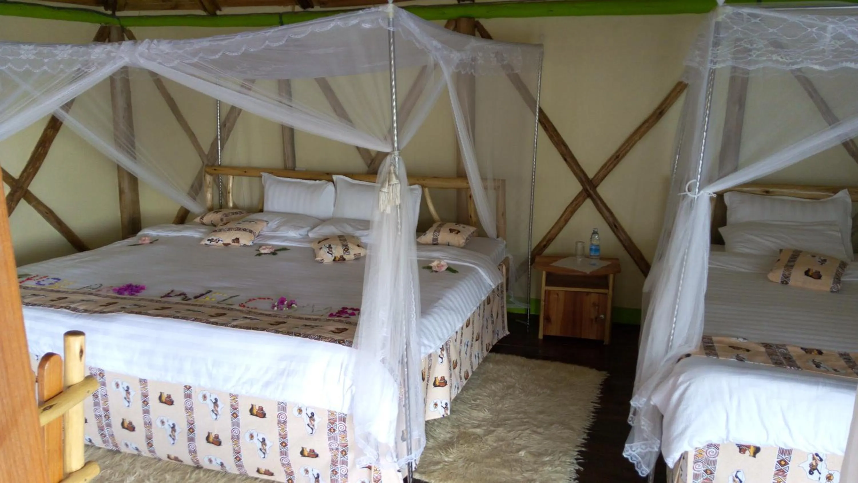 Bed in Lake Bunyonyi Rock Resort