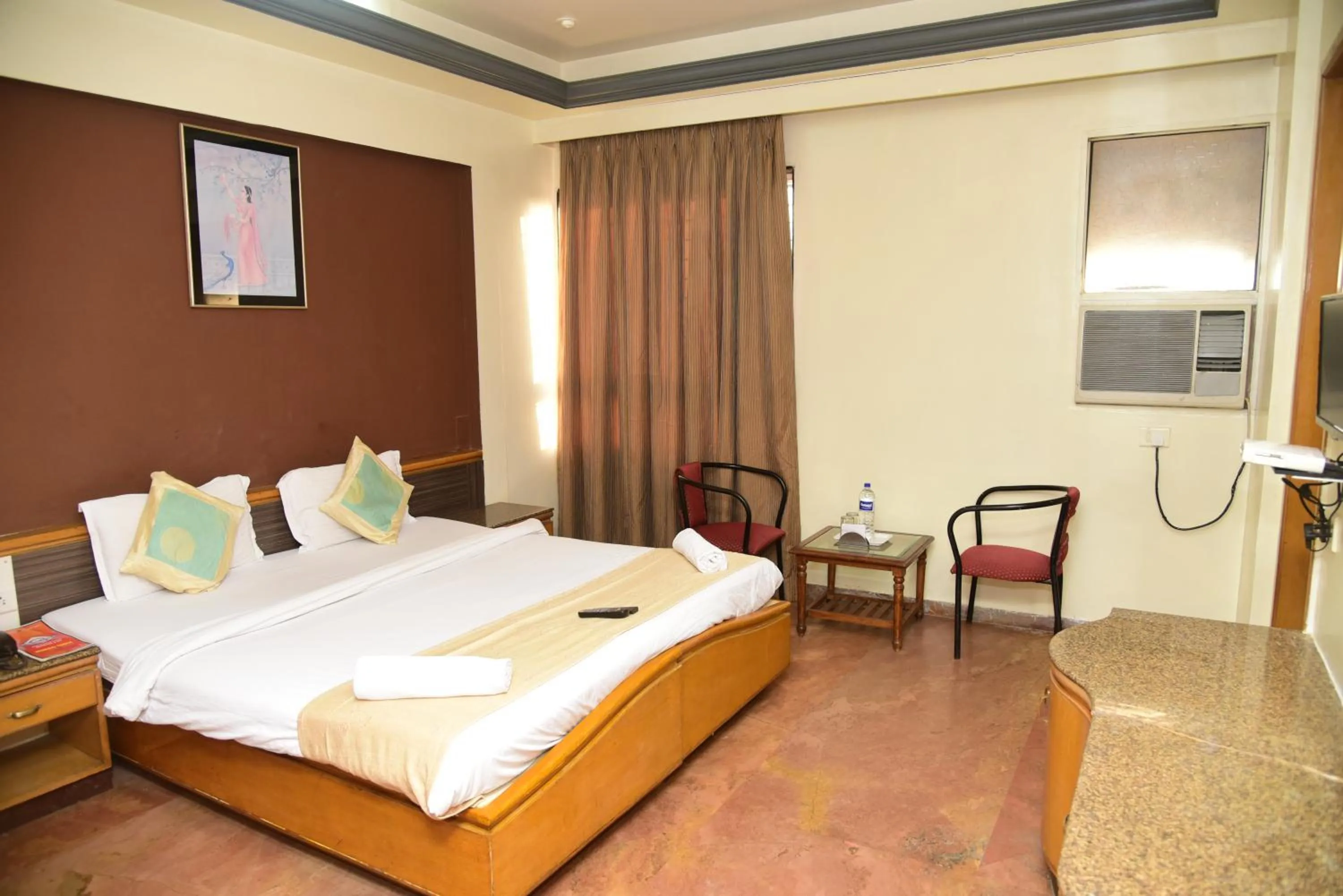 Bedroom, Bed in Celebrations Inn Pune