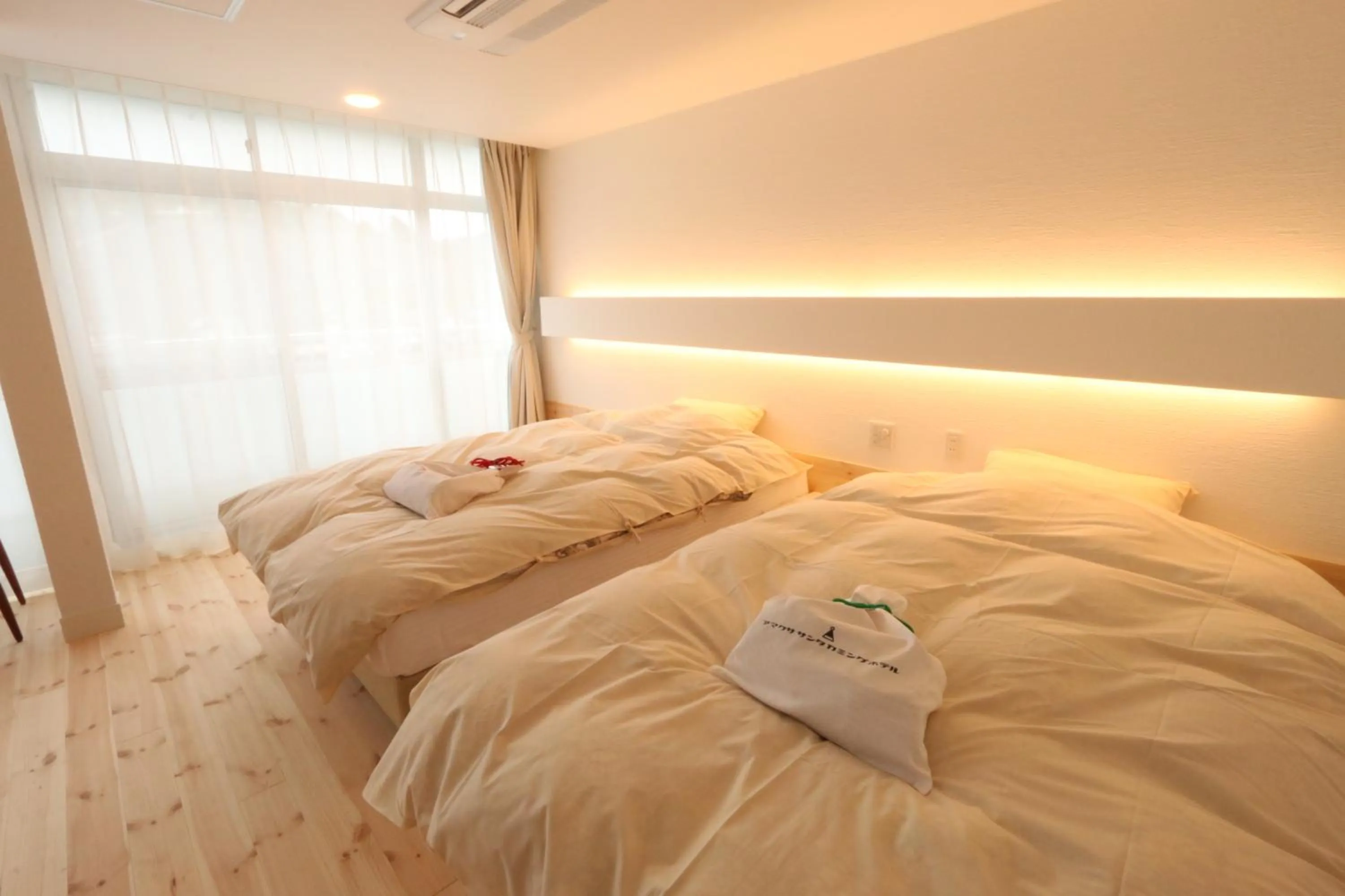 Bed in Amakusa Santacoming Hotel