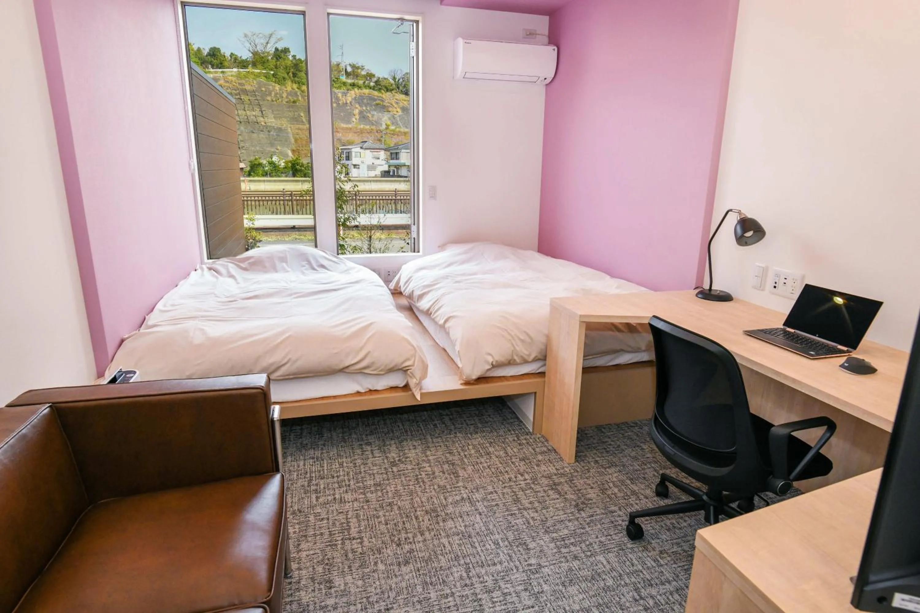 Bed in Amakusa Santacoming Hotel