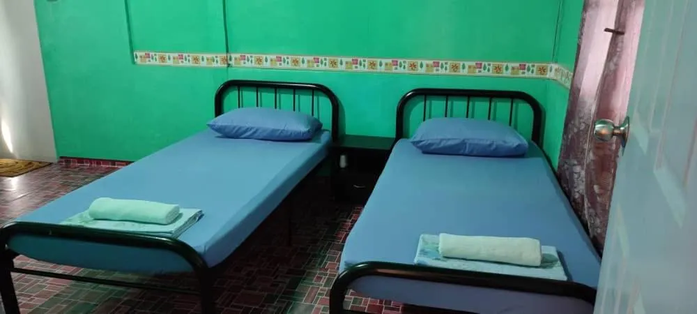 Bed in Taun Gusi Village Homestay