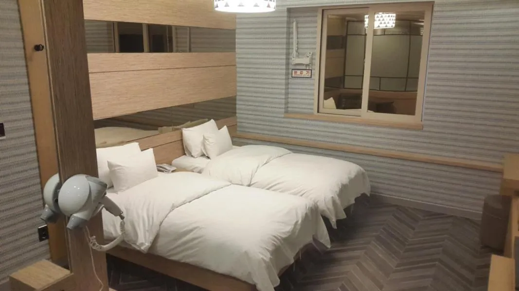 Bed in Jinju Kai Hotel