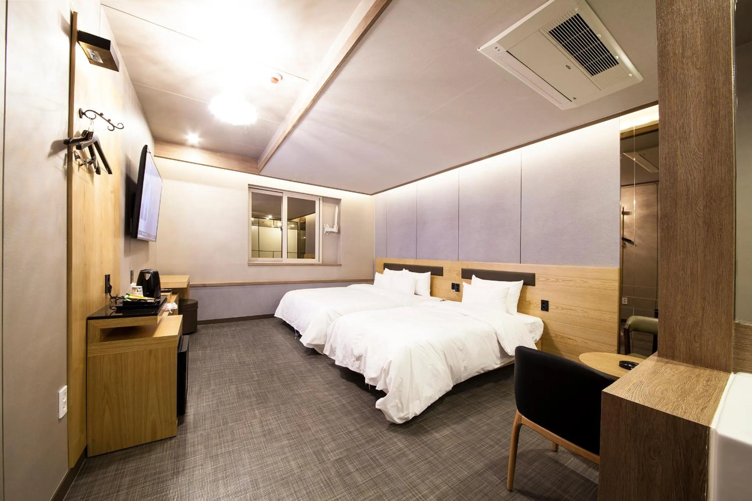 Bed in Jinju Kai Hotel