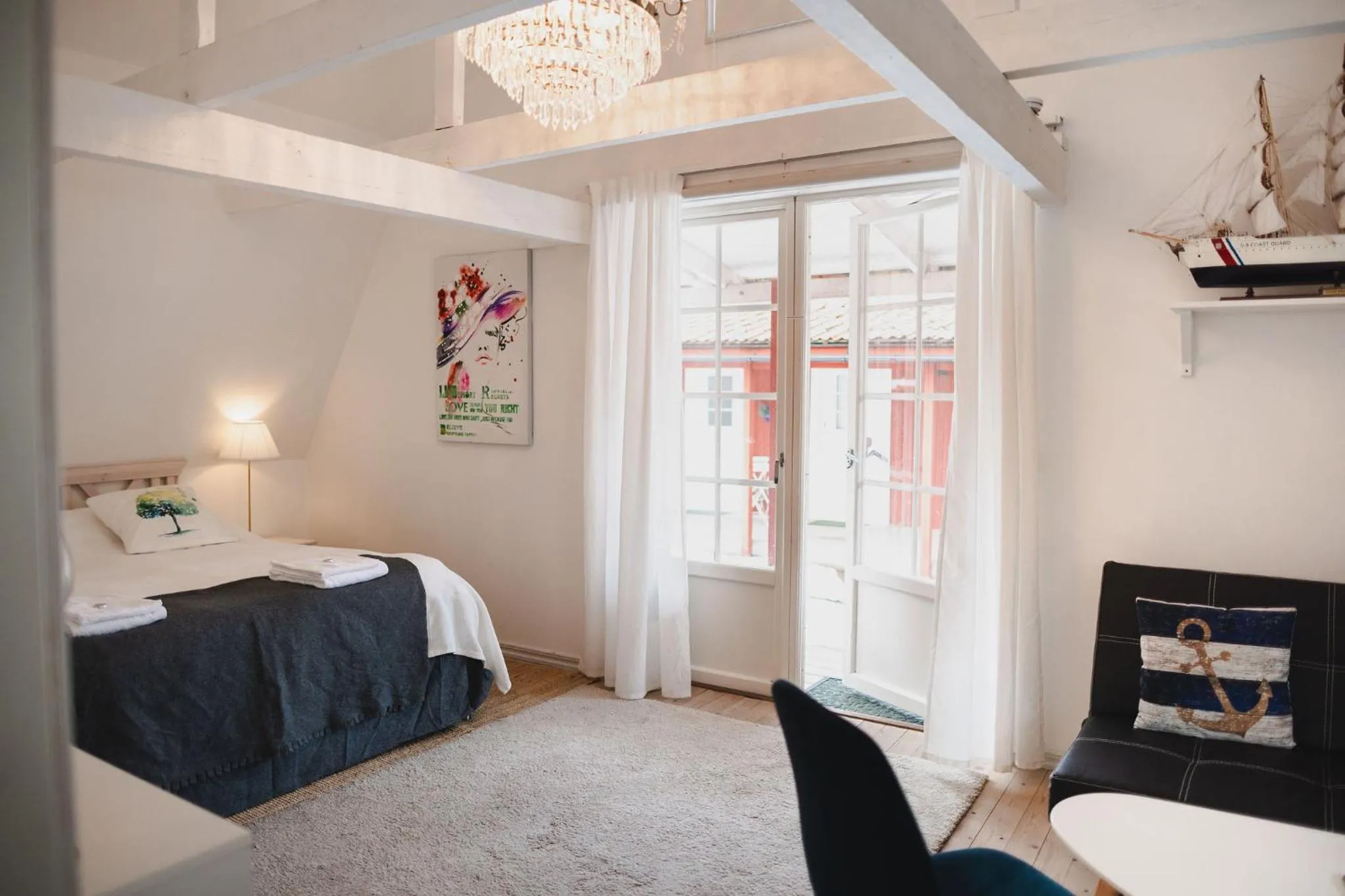 Photo of the whole room, Bed in Gårdshotell Klockargården Öregrund