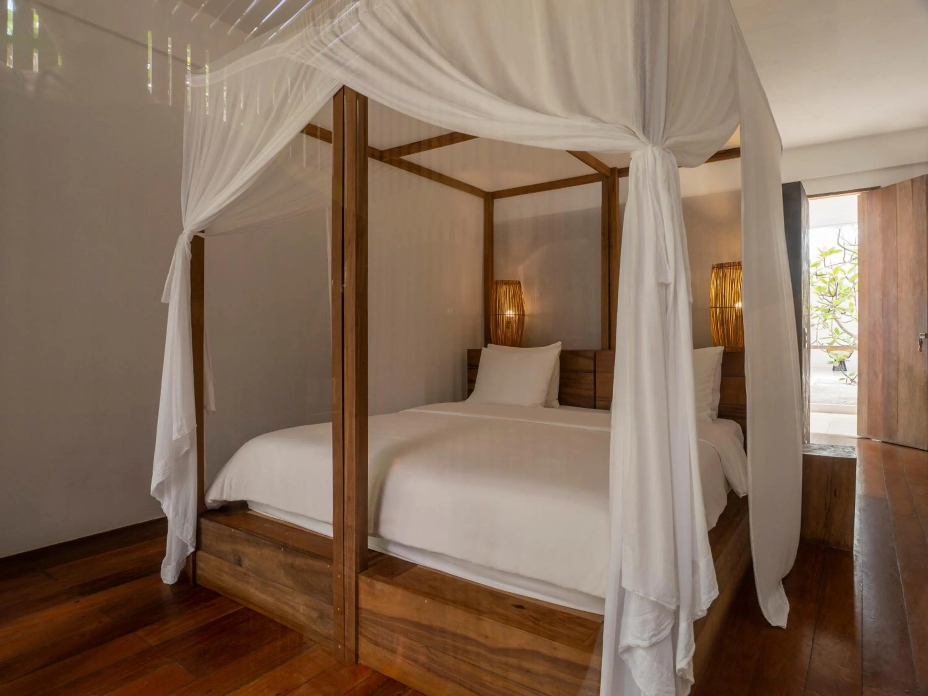 Bed in KA BRU Beach Boutique Hotel