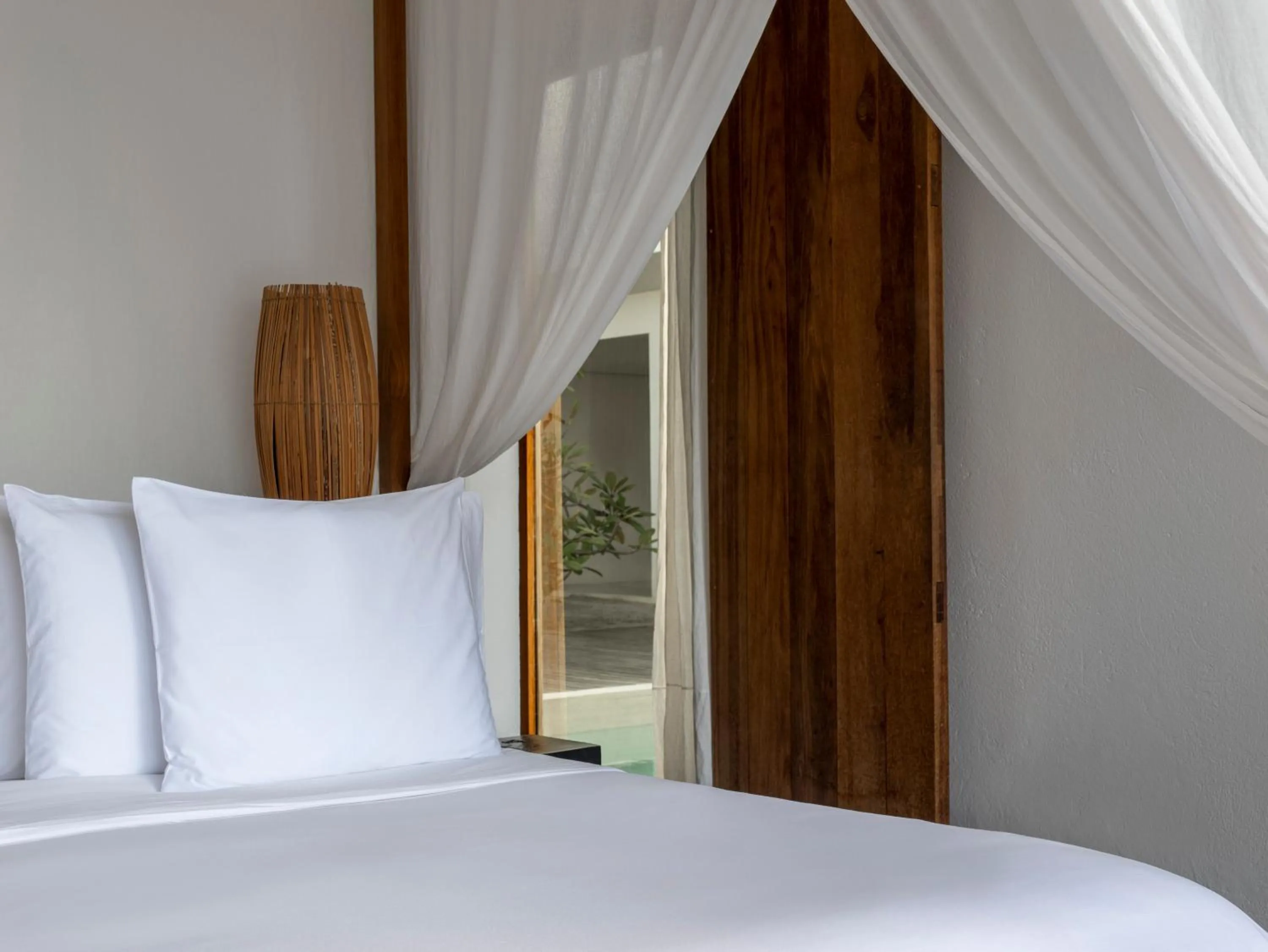 Bed in KA BRU Beach Boutique Hotel