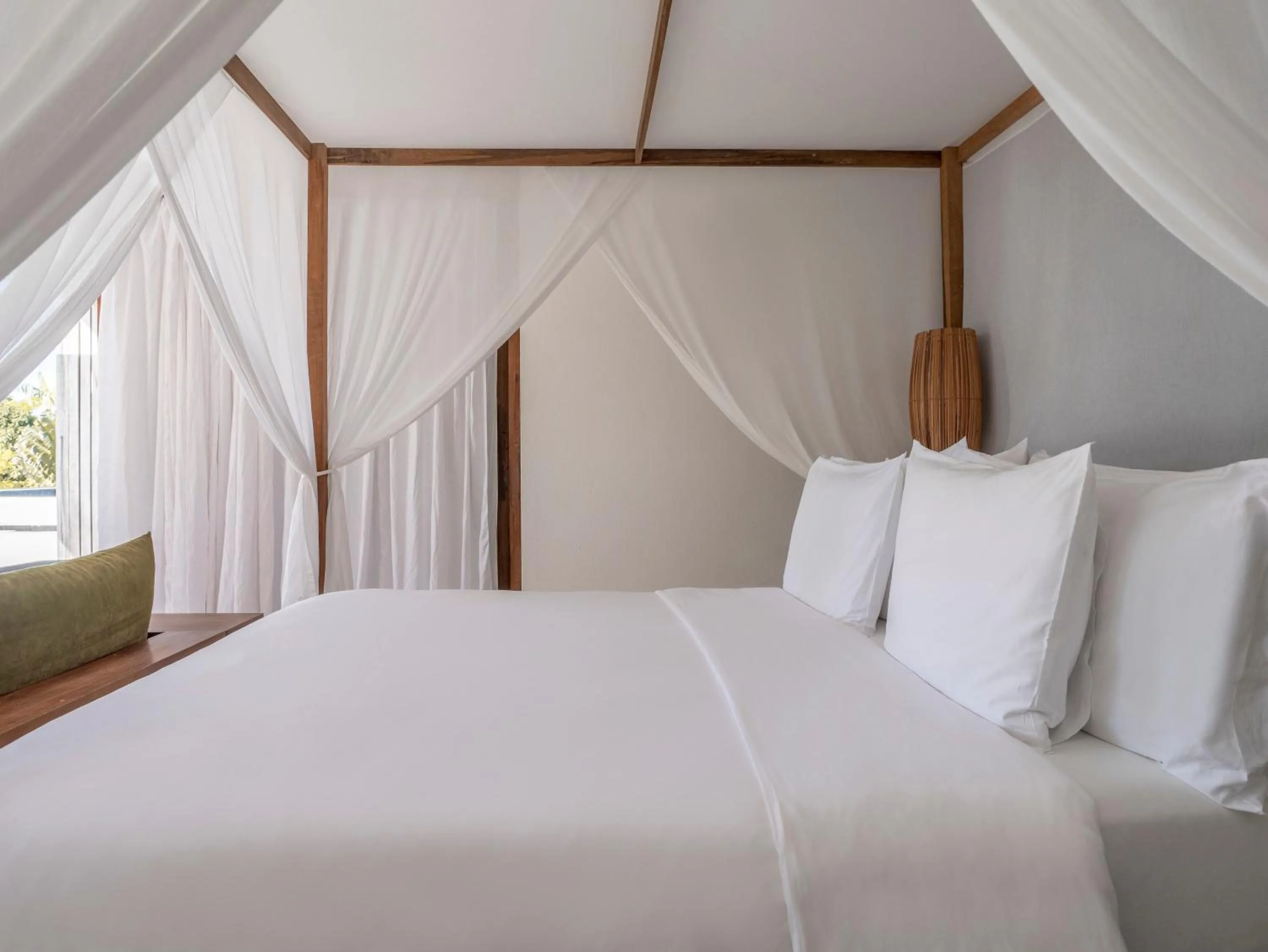 Bed in KA BRU Beach Boutique Hotel