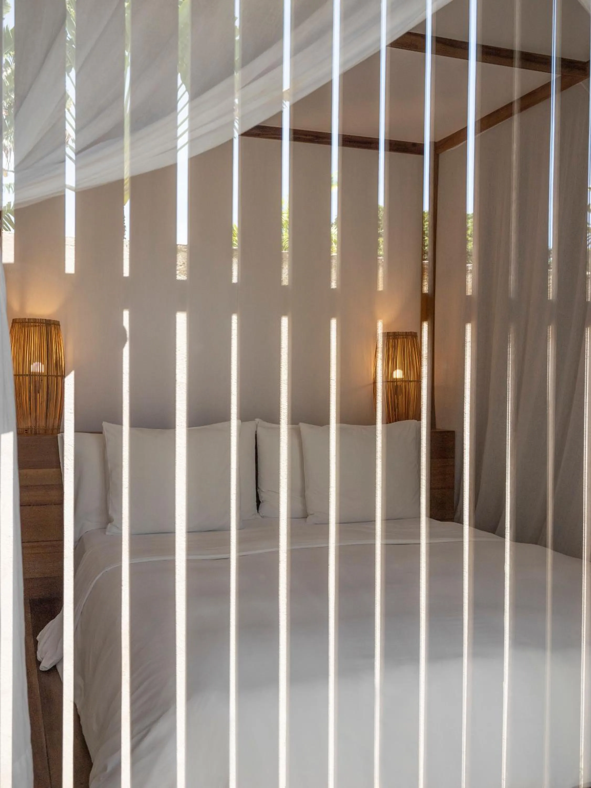 Bed in KA BRU Beach Boutique Hotel