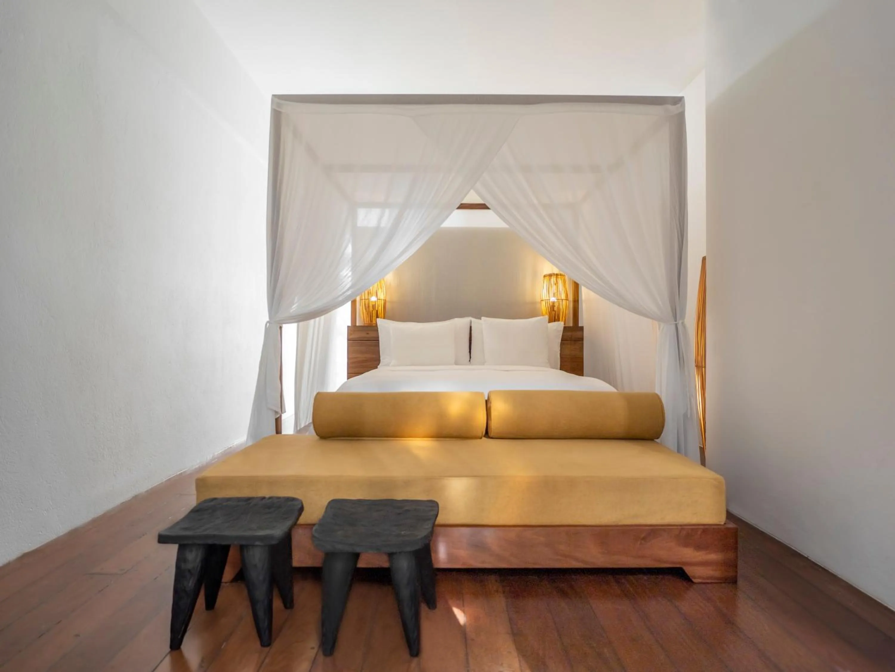 Bed in KA BRU Beach Boutique Hotel