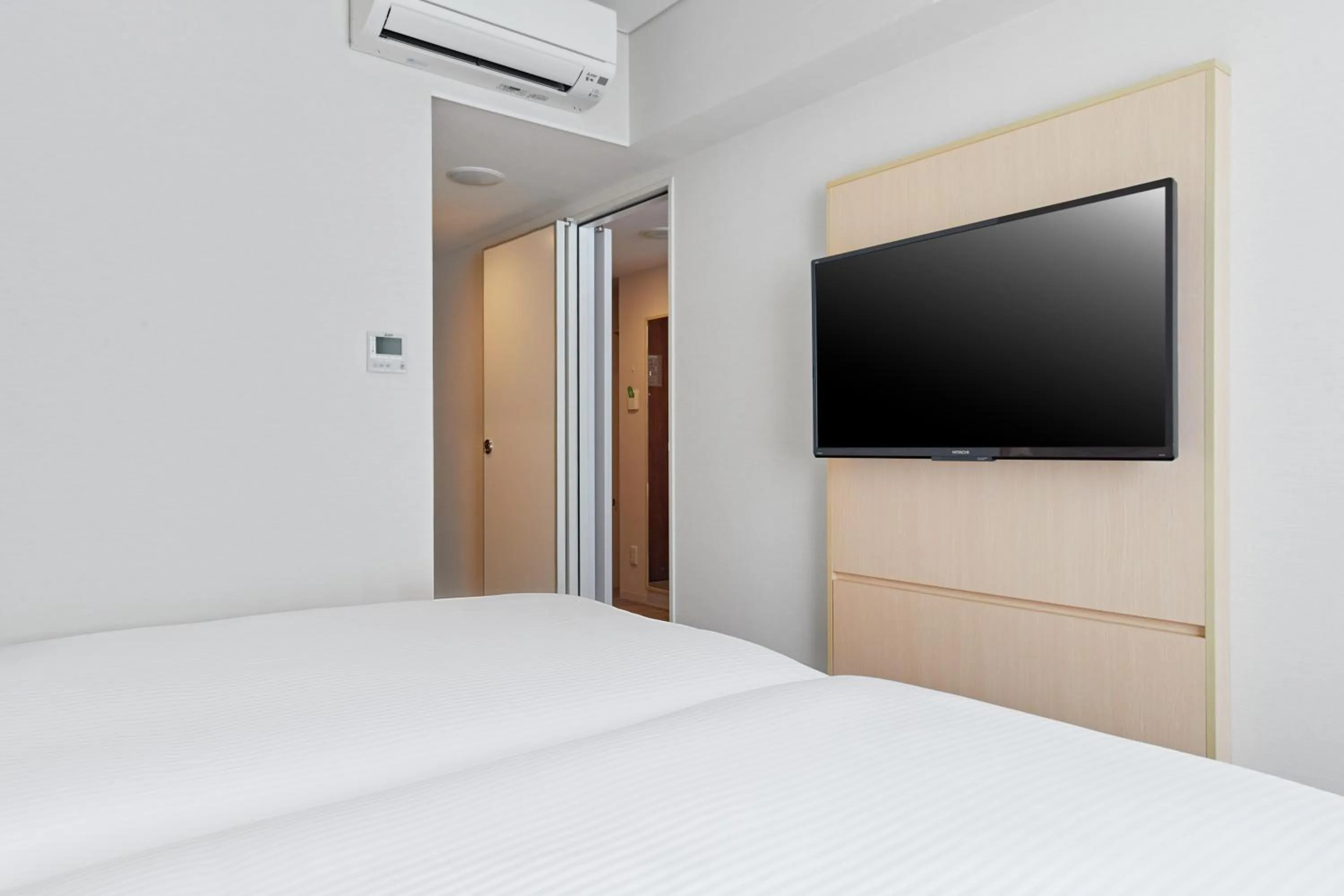 Bed in Sotetsu Fresa Inn Kyoto-Hachijoguchi