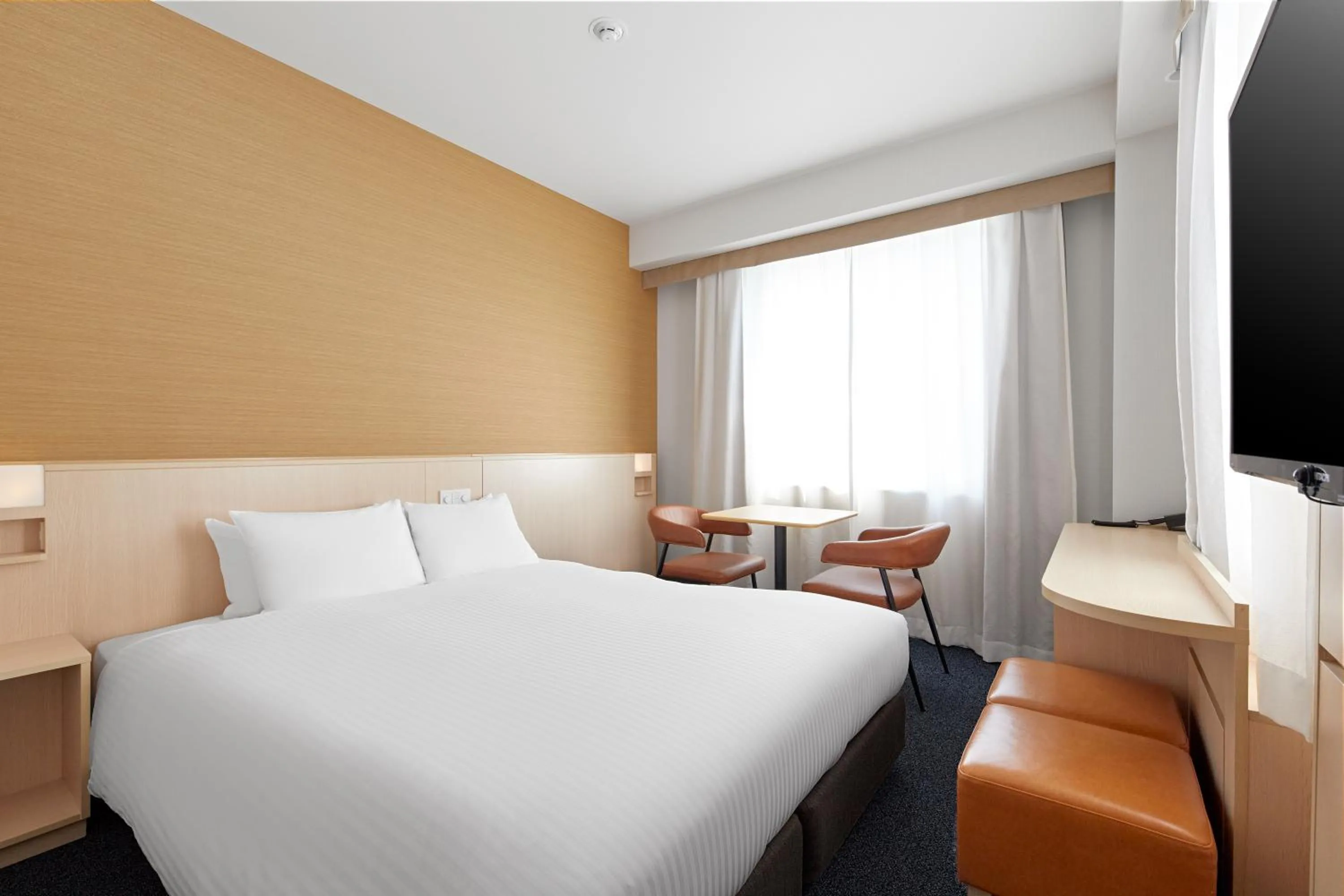 Bed in Sotetsu Fresa Inn Kyoto-Shijokarasuma